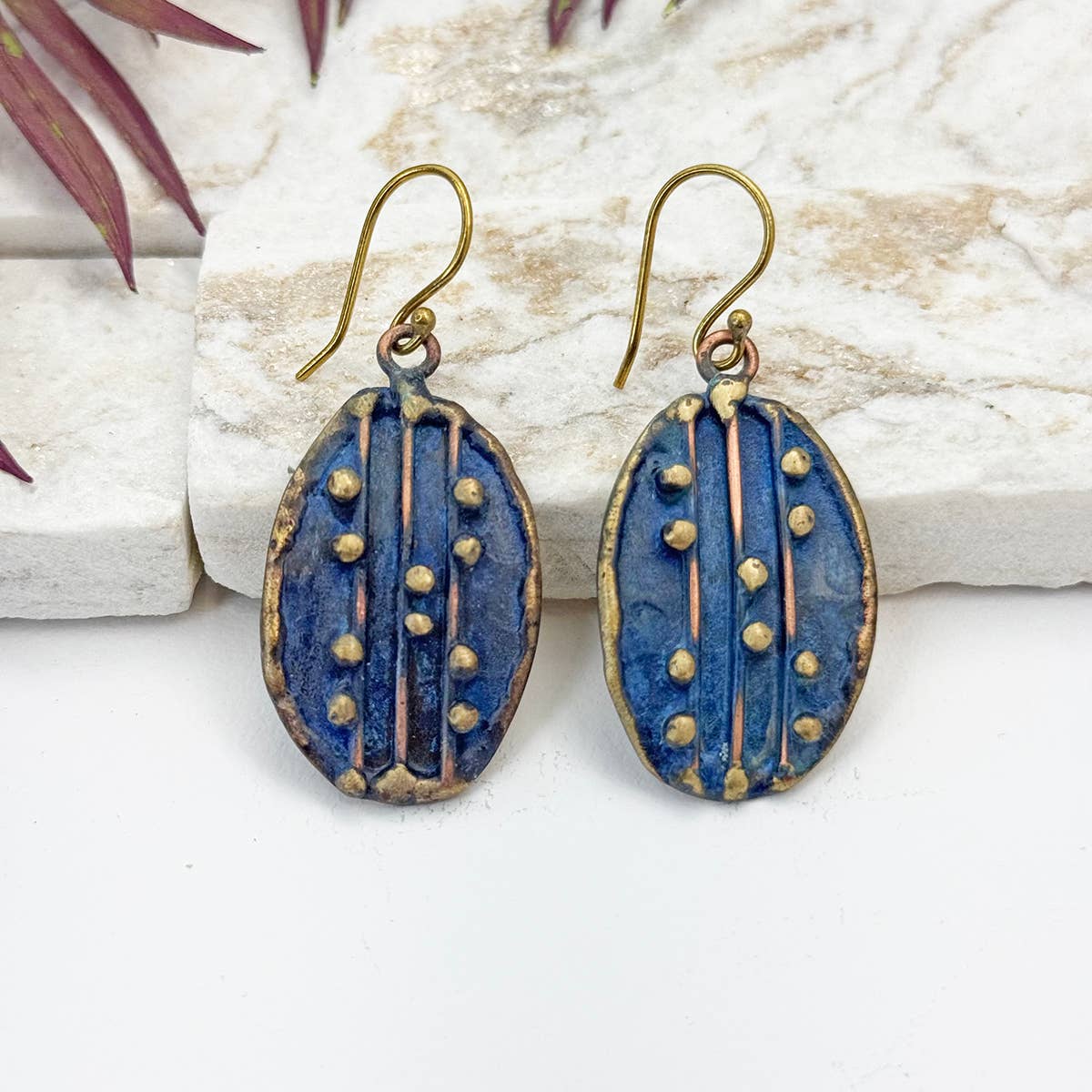 handcrafted navy blue dotted brass earrings at the rustic barn in killingworth ct