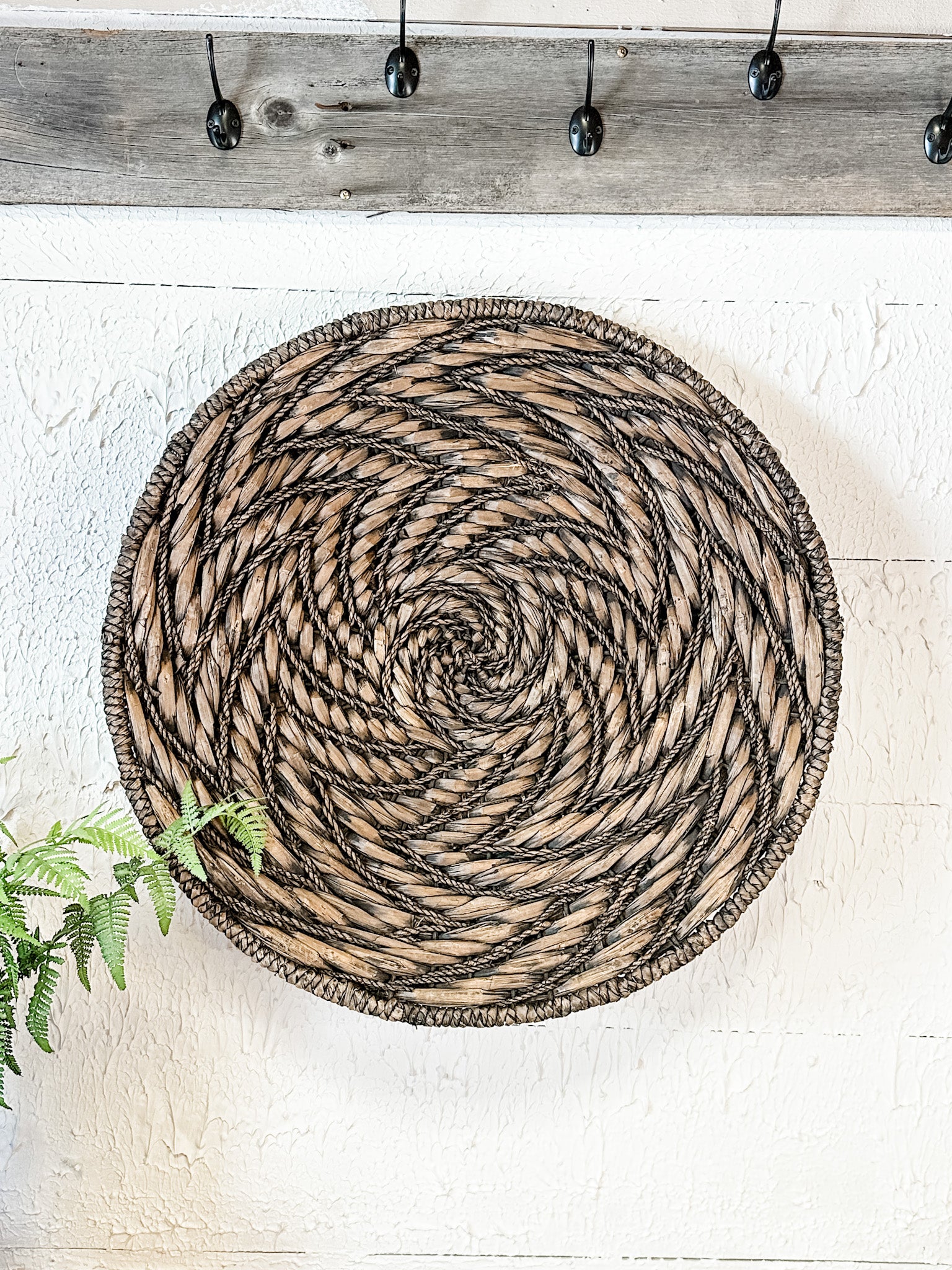water hyacinth woven medallion wall basket at the rustic barn in killingworth ct