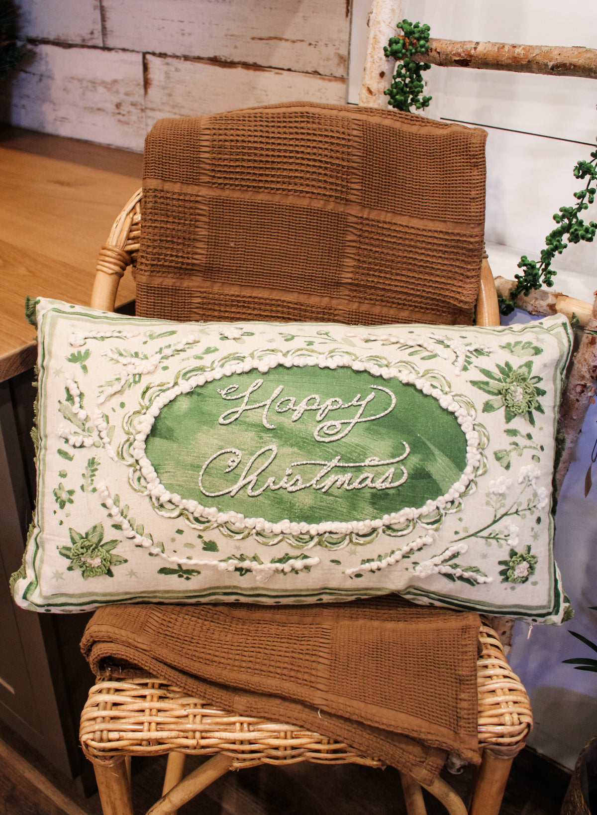 happy christmas green and cream floral 24 inch lumbar pillow for the holidays for sale at the rustic barn in killingworth, CT