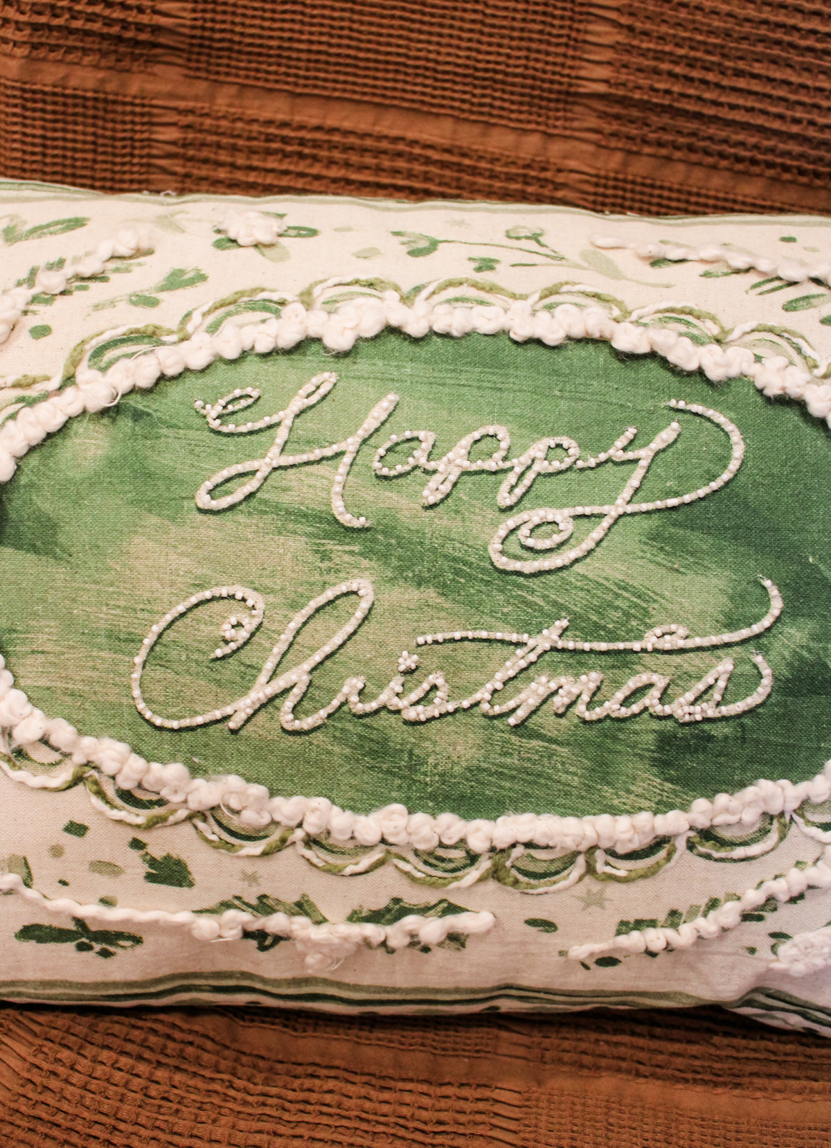 happy christmas green and cream floral 24 inch lumbar pillow for the holidays with pearl lettering for sale at the rustic barn in killingworth, CT