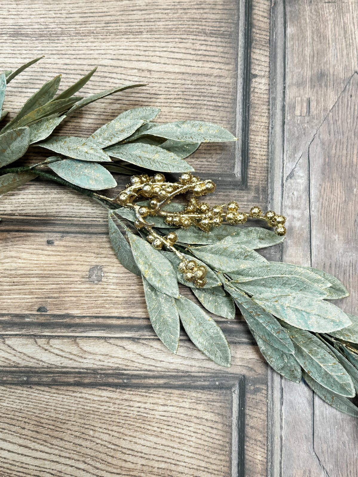 gold berry holiday bay leaf garland for christmas for sale at the rustic barn in killingworth, CT