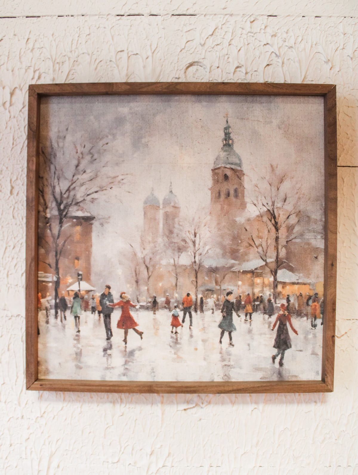 beautiful peaceful fun ice skating scene with holiday church in background and snowy scene for Christmas wall art for sale at the rustic barn in killingworth, CT
