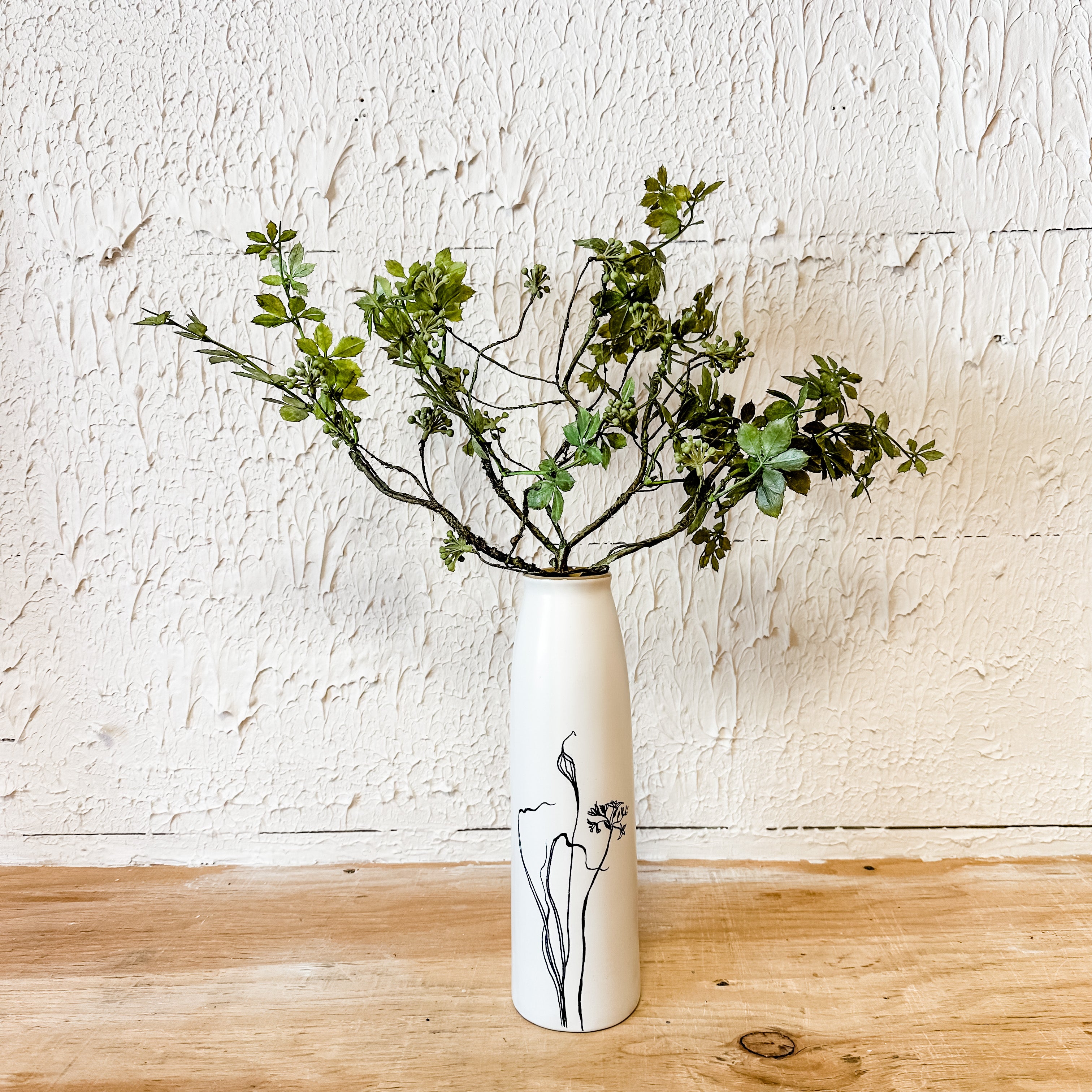 cream and black sleek budvase with floral design the rustic barn ct