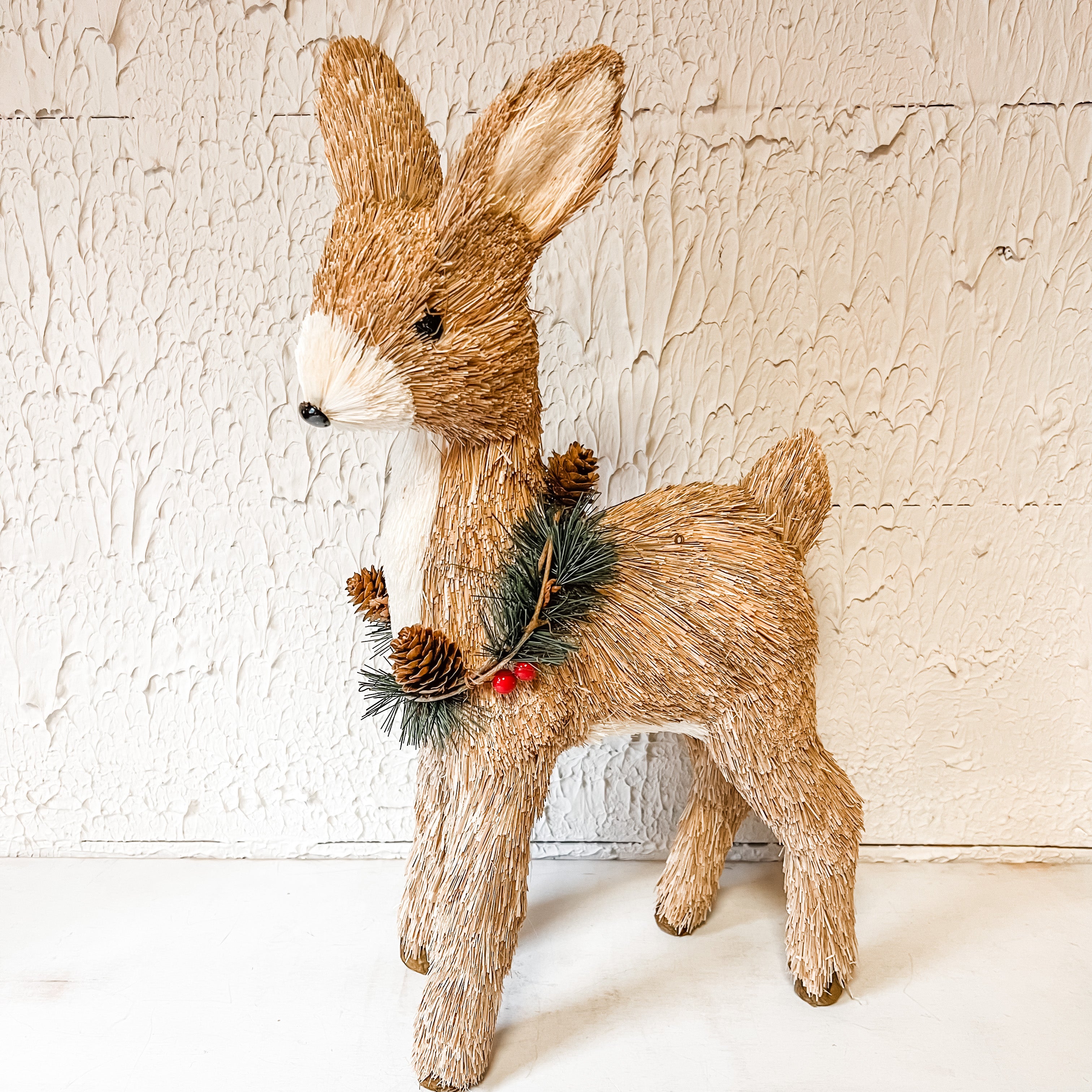 grass standing deer with a wreath around neck the Rustic barn ct