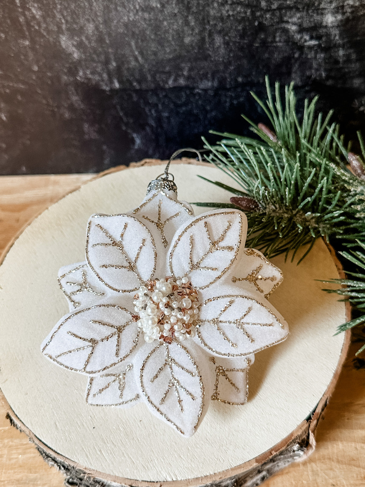 poinsettia ivory colored beaded glass ornament from the rustic barn in killingworth, CT
