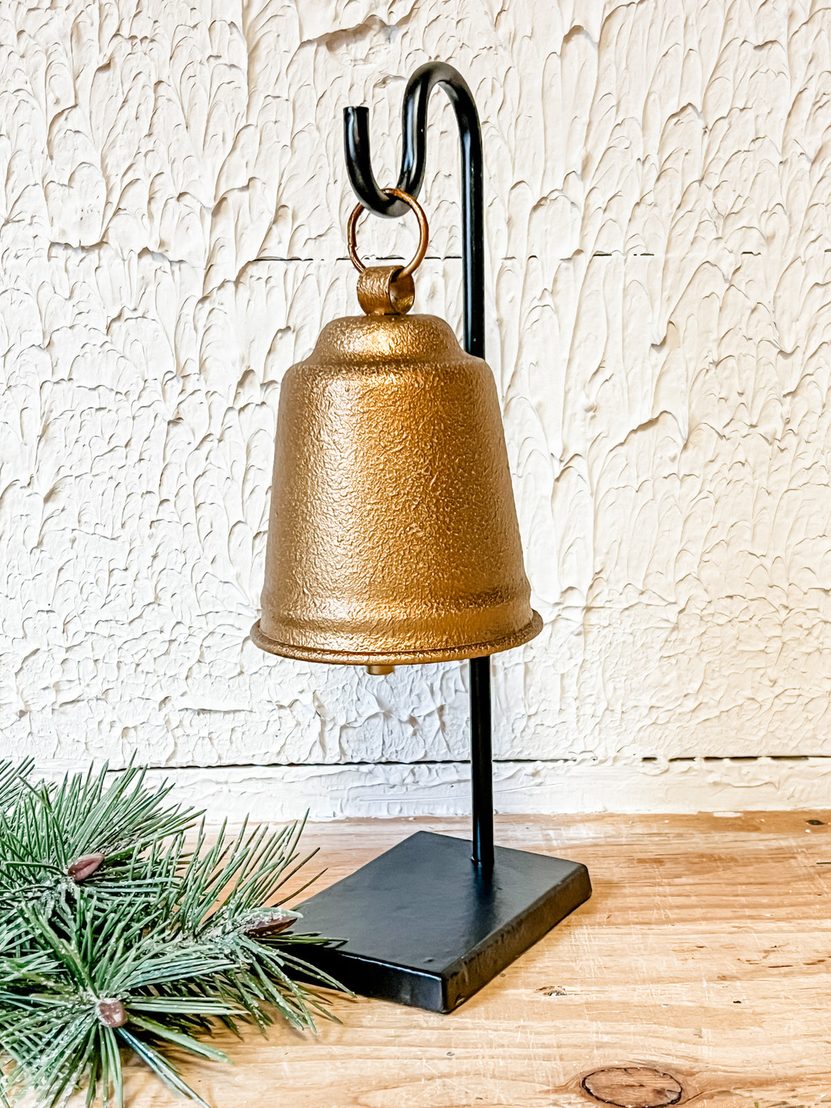 large metal stand with gold bell at the rustic barn in killingworth ct