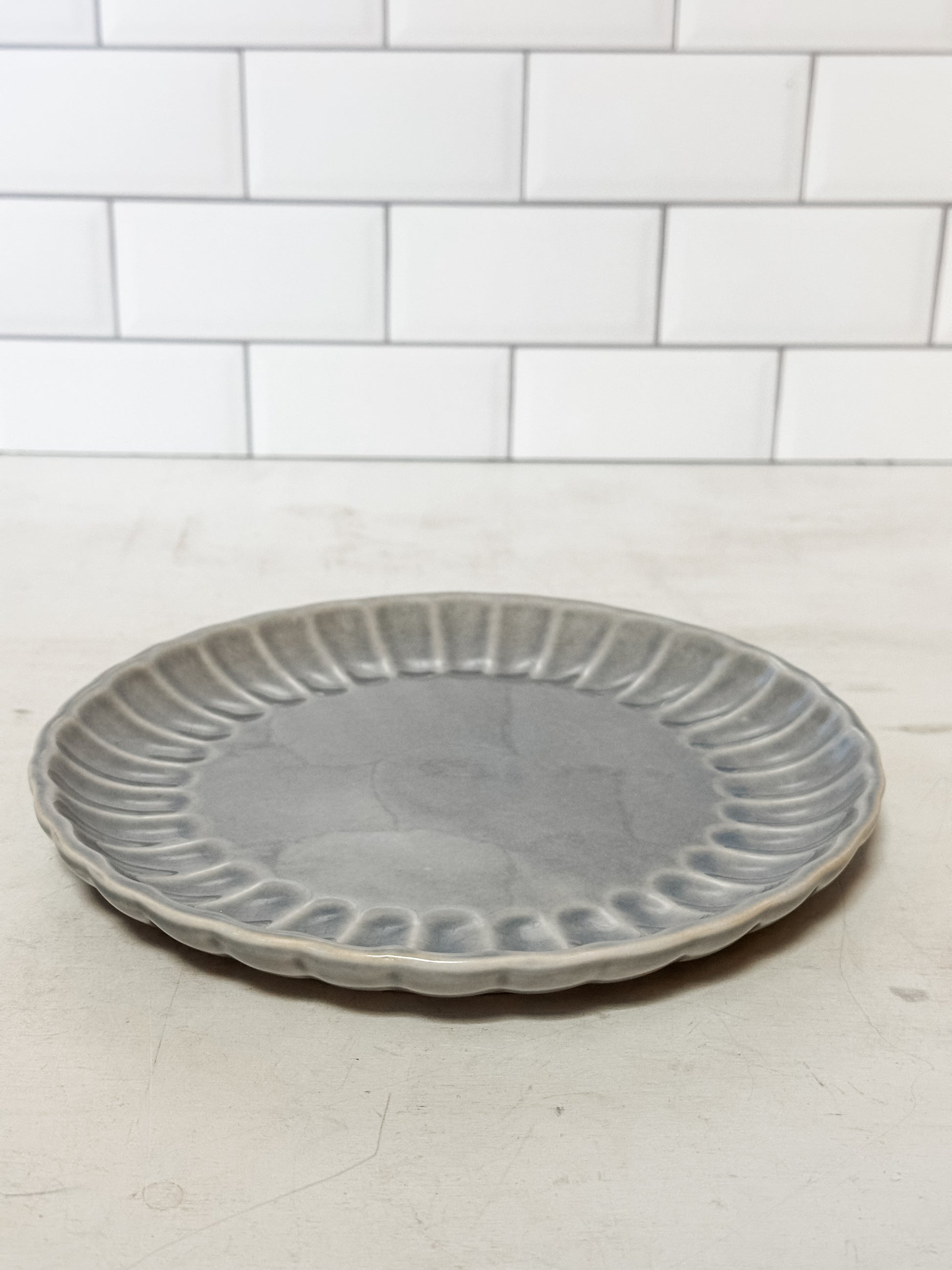 light blue stoneware fluted plate at The Rustic Barn in Killingworth, CT