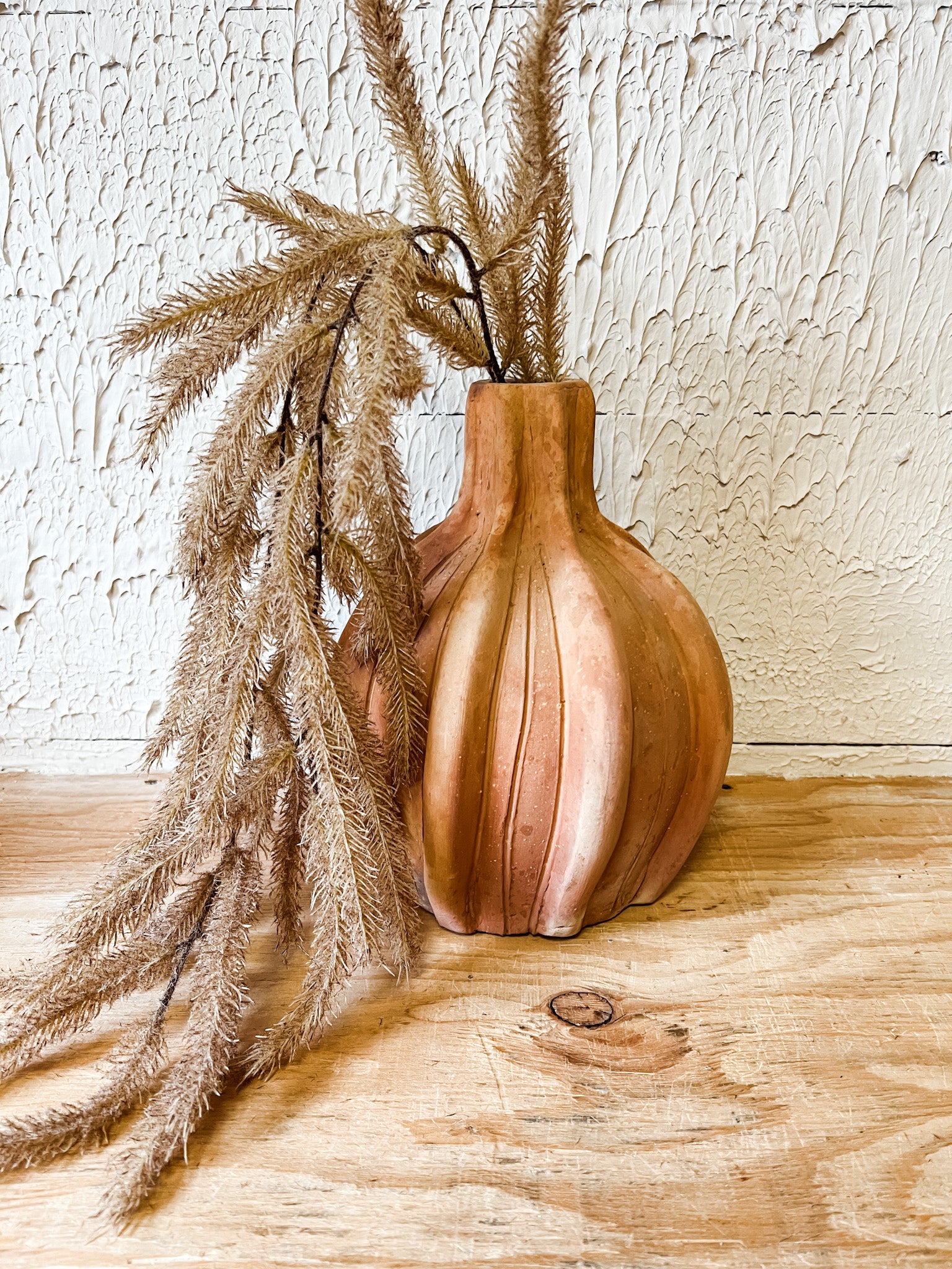 lightly flocked hanging cattail spray at the rustic barn in killingworth ct
