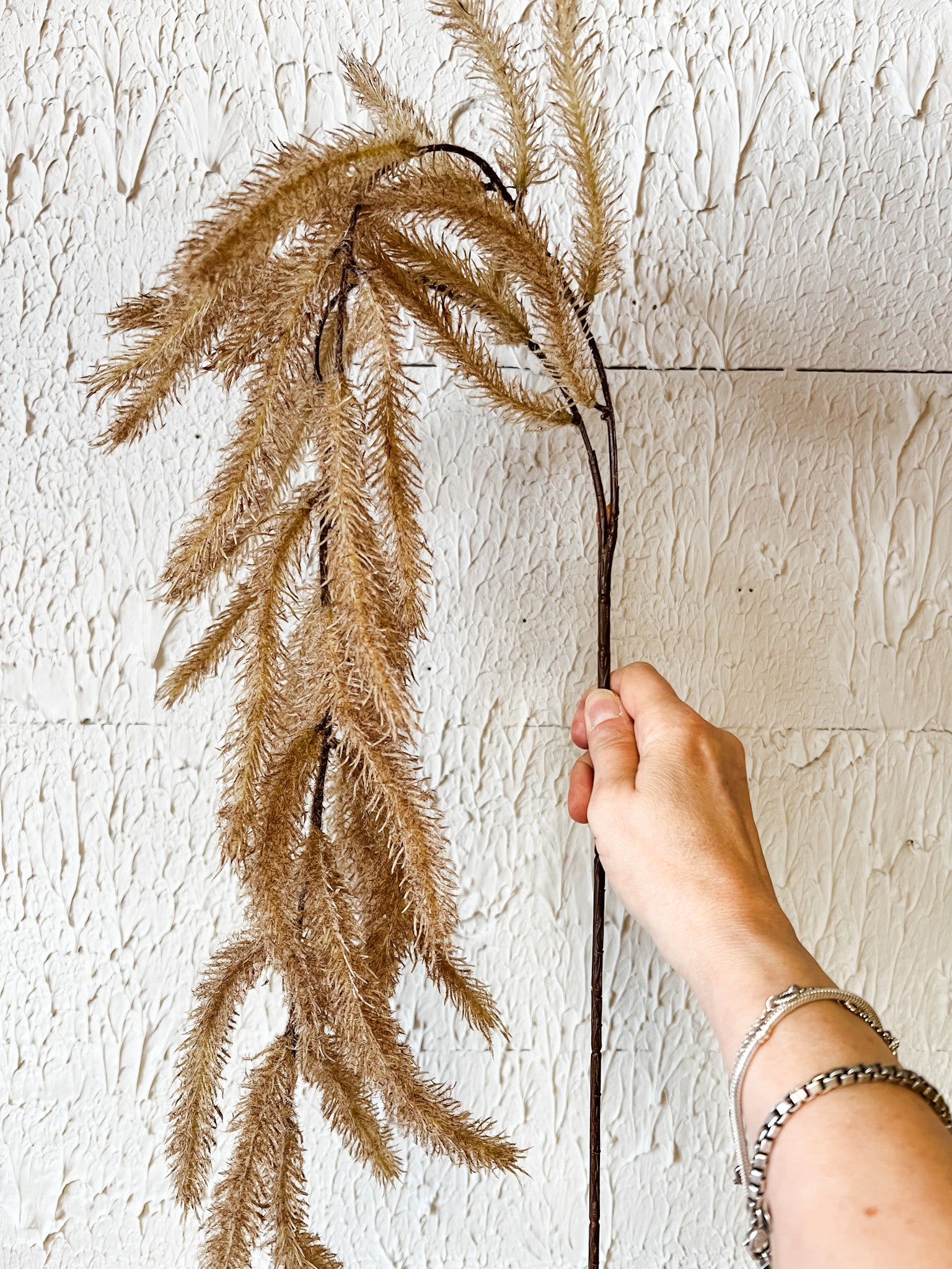 lightly flocked hanging cattail spray at the rustic barn in killingworth ct