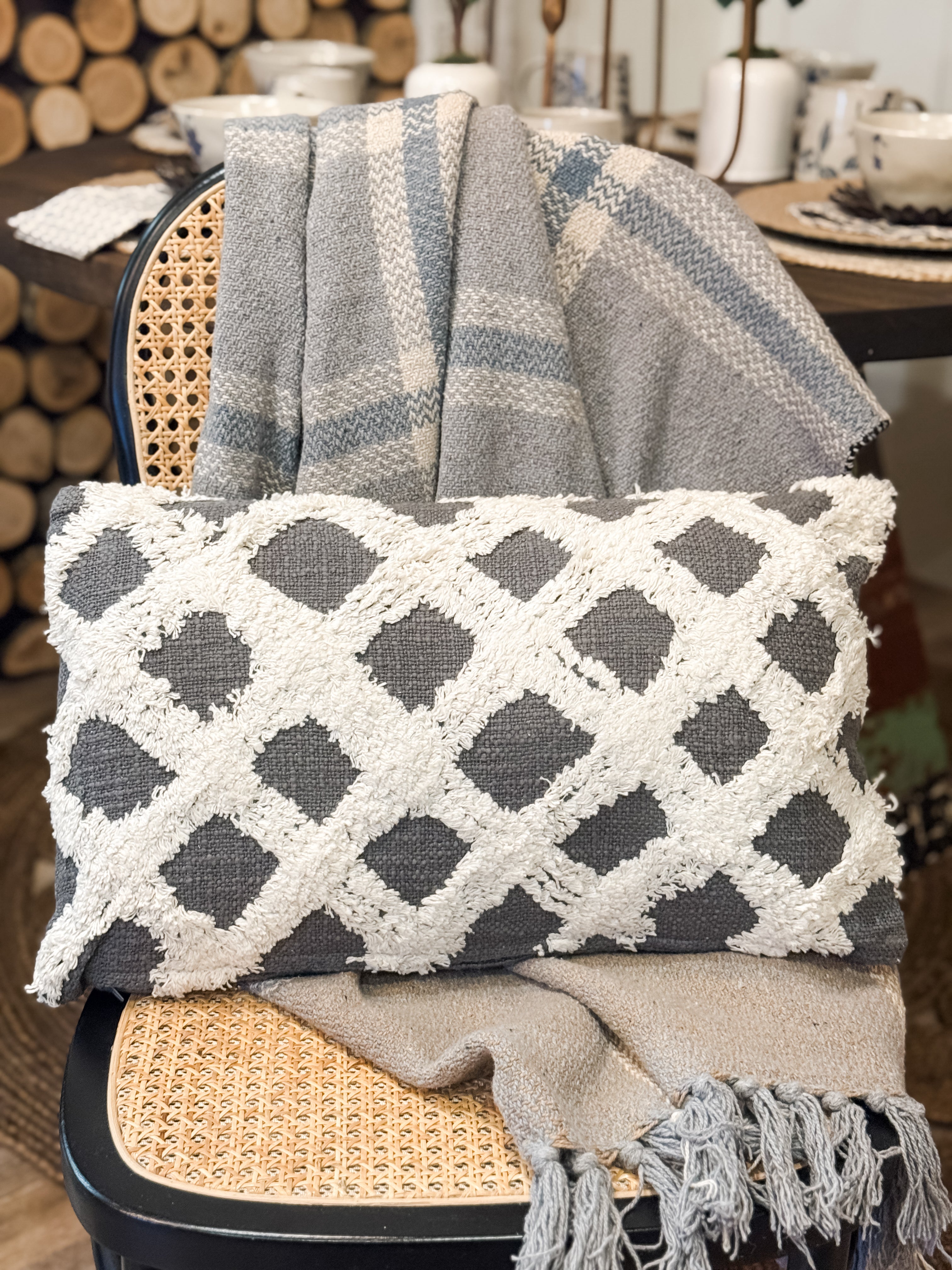 grey and white lumbar pillow with woven criss cross pattern at the rustic barn in Killingworth ct