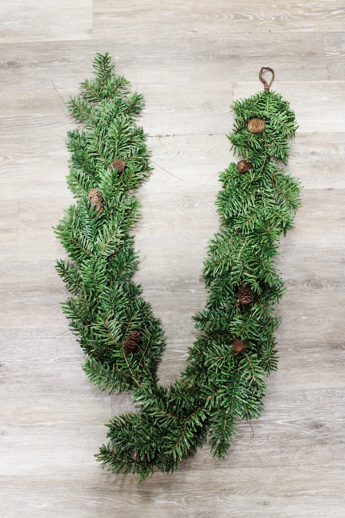 Luxe glacier snow frosted winter garland with pinecones for christmas for sale at the rustic barn in Killingworth, CT