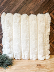 luxury cream faux fur ribbed pillow at the rustic barn in killingworth ct