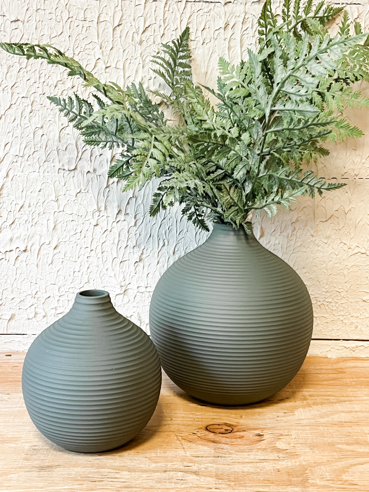 matte sleek gray ribbed metal vases at the rustic barn in killingworth ct