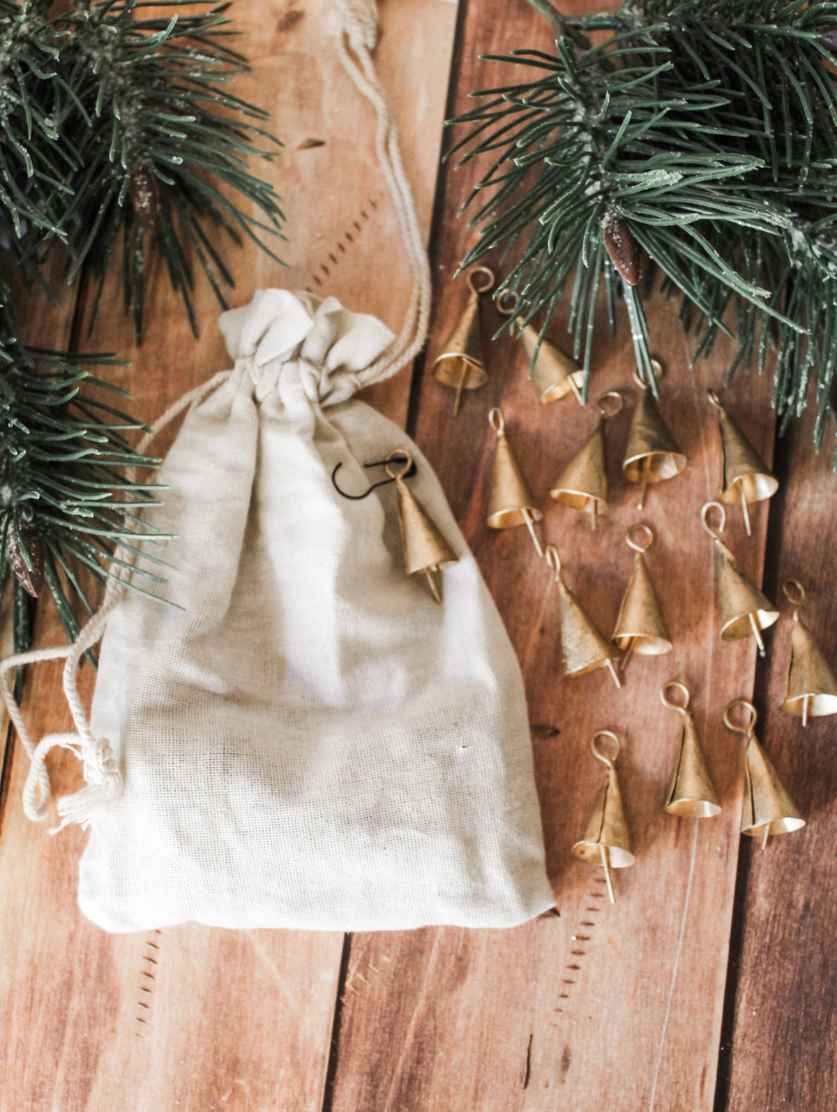 metal mini decorative bells for christmas silver and gold in drawstring cream bags for the holidays tiny decorative bells for sale at the rustic barn in Killingworth, CT