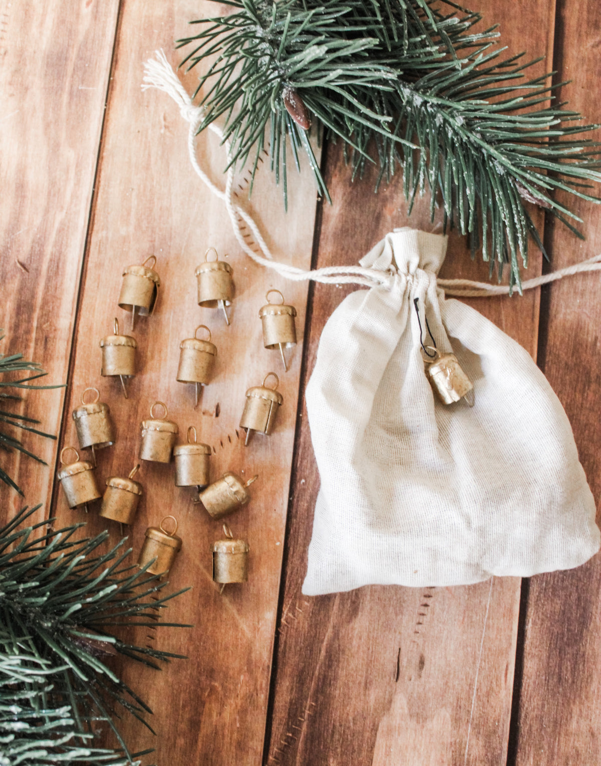metal mini decorative bells for christmas silver and gold in drawstring cream bags for the holidays tiny decorative bells for sale at the rustic barn in Killingworth, CT