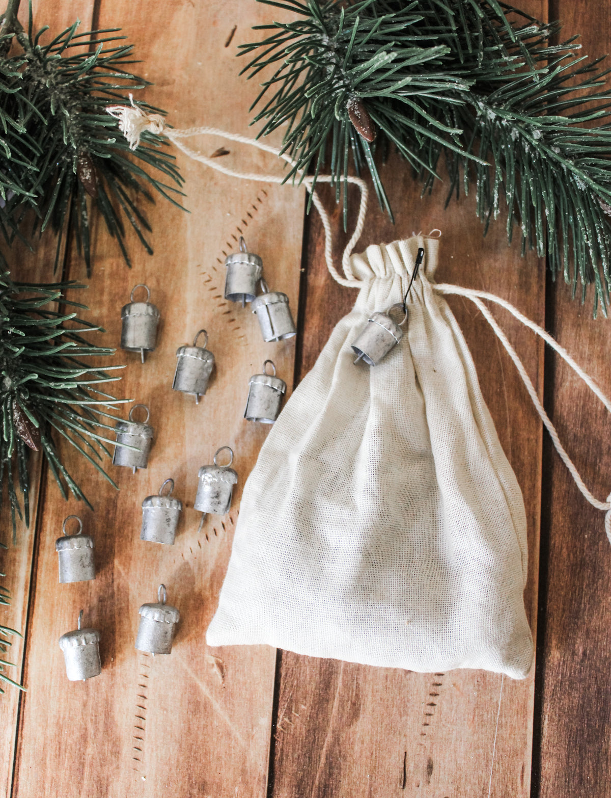 metal mini decorative bells for christmas silver and gold in drawstring cream bags for the holidays tiny decorative bells for sale at the rustic barn in Killingworth, CT