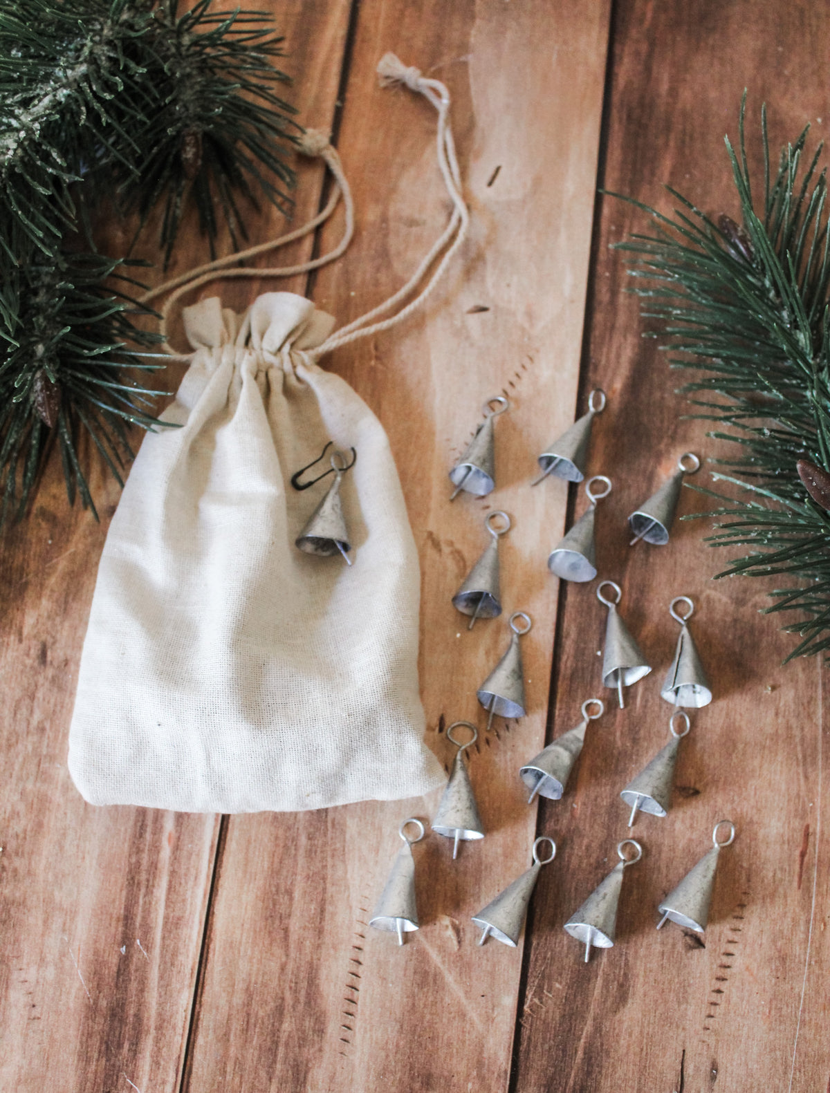metal mini decorative bells for christmas silver and gold in drawstring cream bags for the holidays tiny decorative bells for sale at the rustic barn in Killingworth, CT