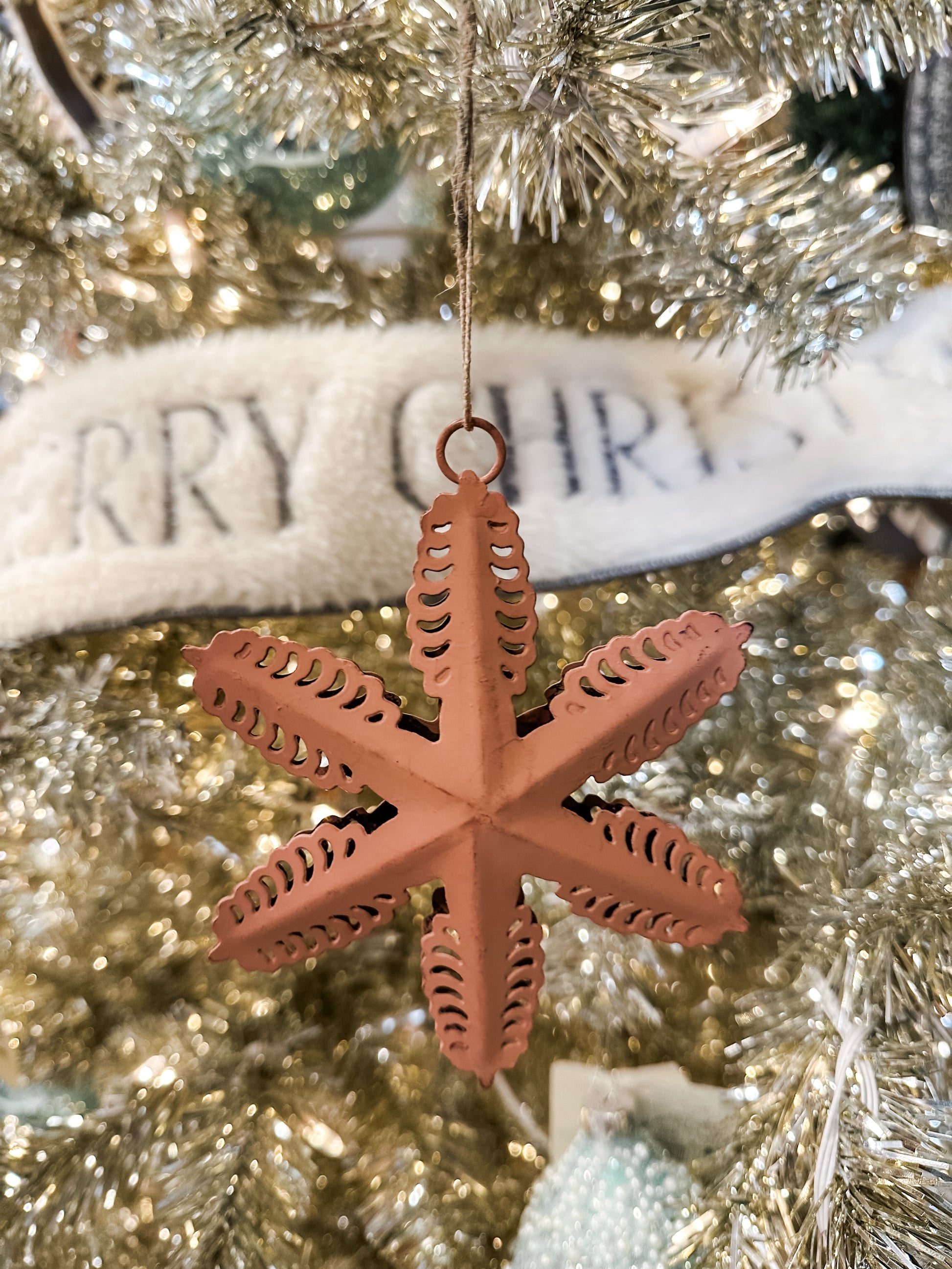 metal star ornament with cut outs at The Rustic Barn in Killingworth CT