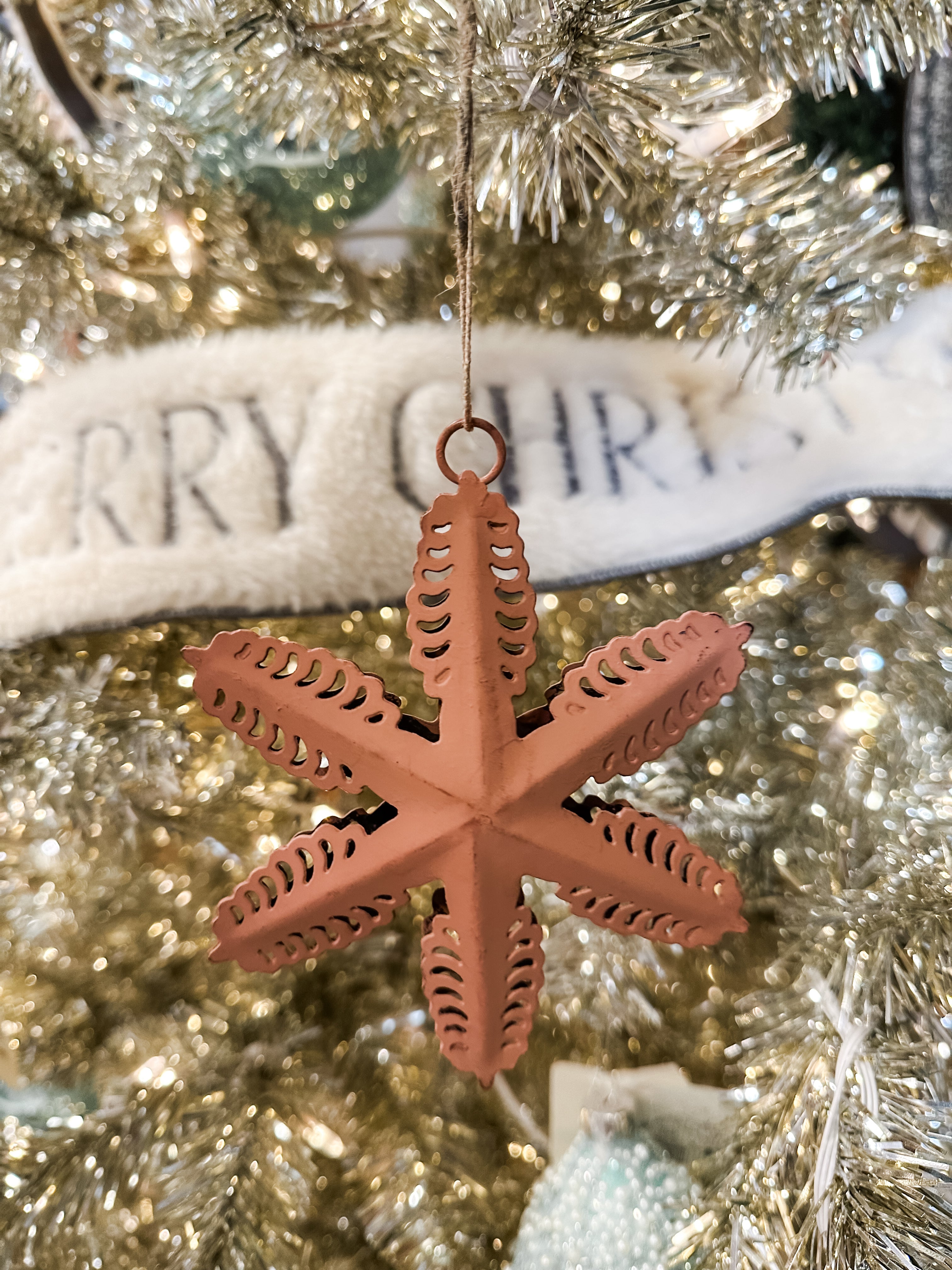 metal star ornament with cut outs at The Rustic Barn in Killingworth CT