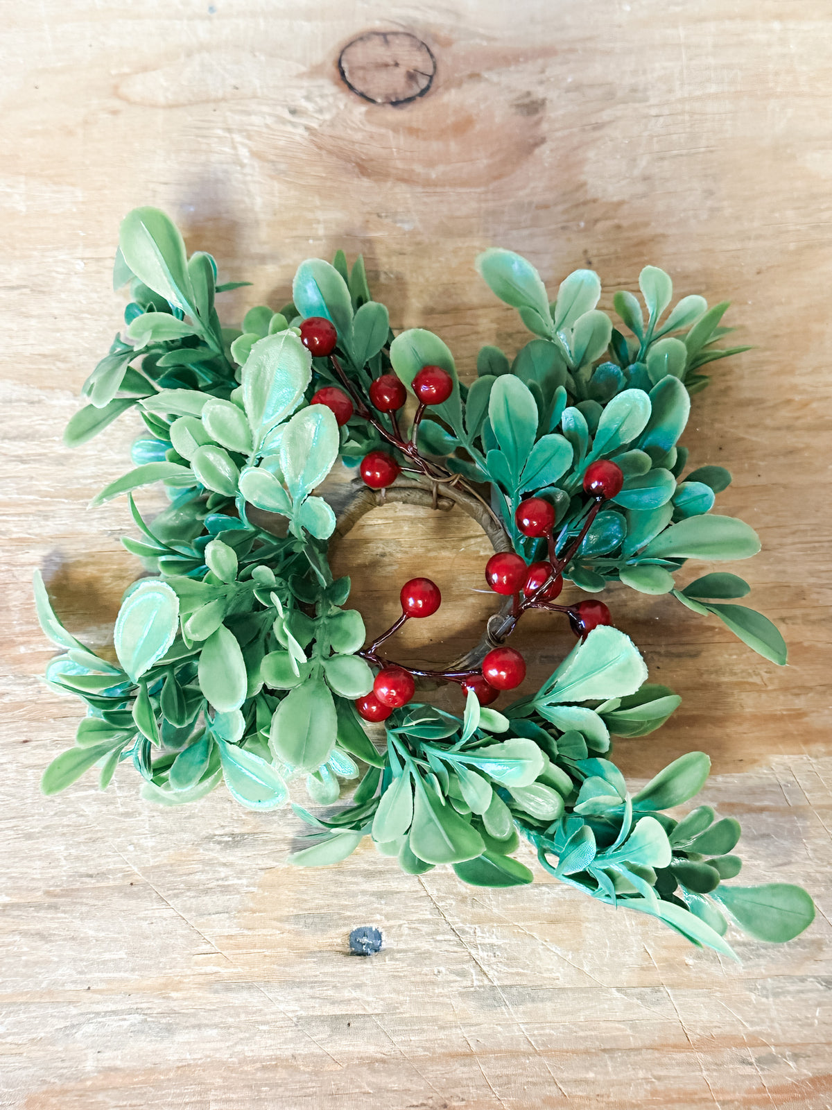 mini taper christmas candles made with boxwood and red holiday berries for sale at the rustic barn in killingworth, CT