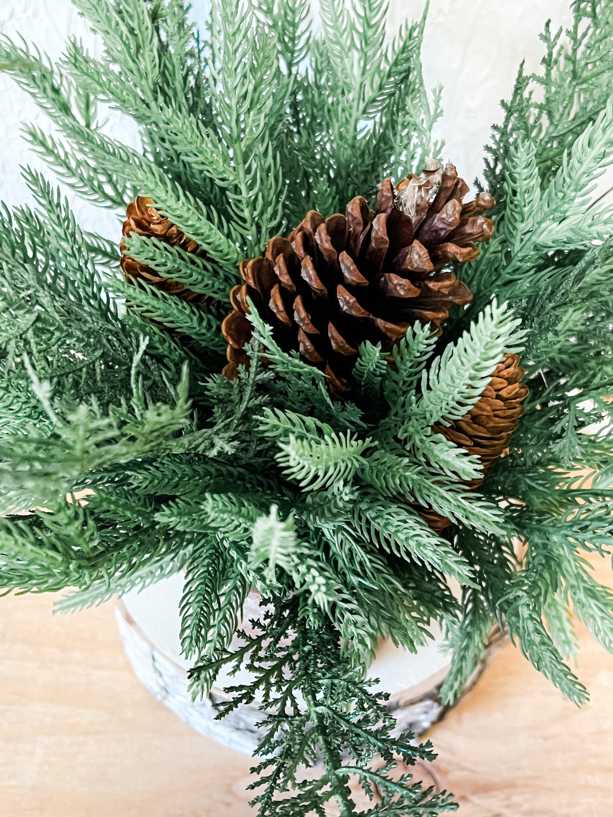 mixed pine and pinecone christmas arrangement at the rustic barn in killingworth ct
