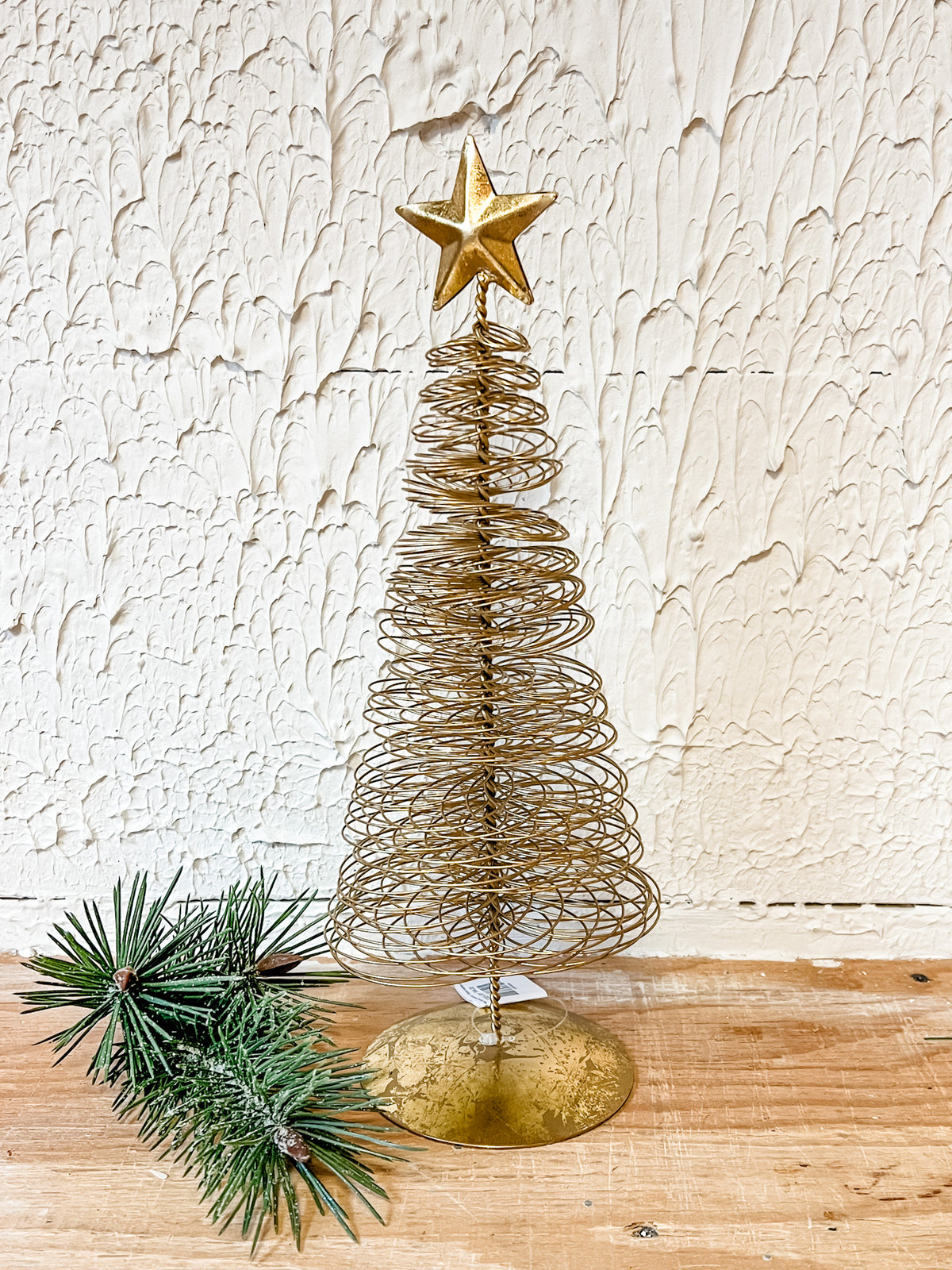 gold wired christmas tree with star on top at the rustic barn in Killingworth ct