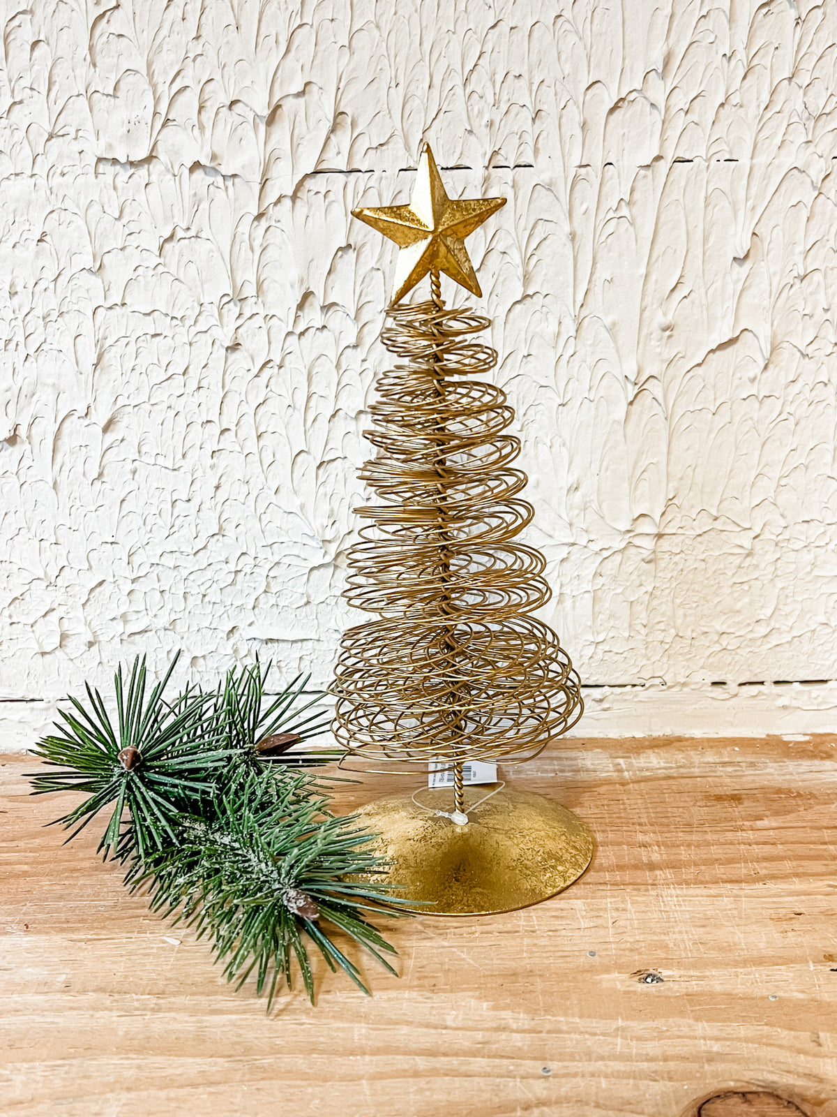 gold wired christmas tree with star on top at the rustic barn in Killingworth ct