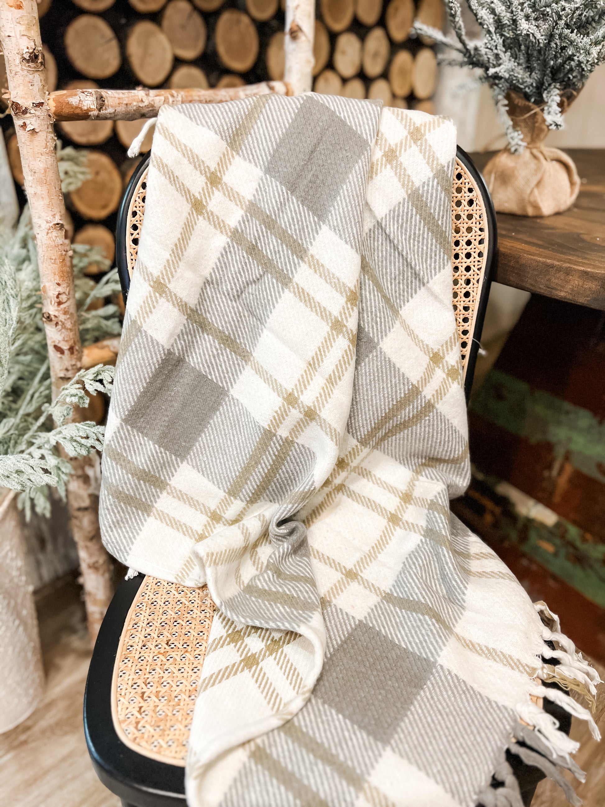 multi colored plaid throw with fringe detail at the rustic barn in killingworth ct
