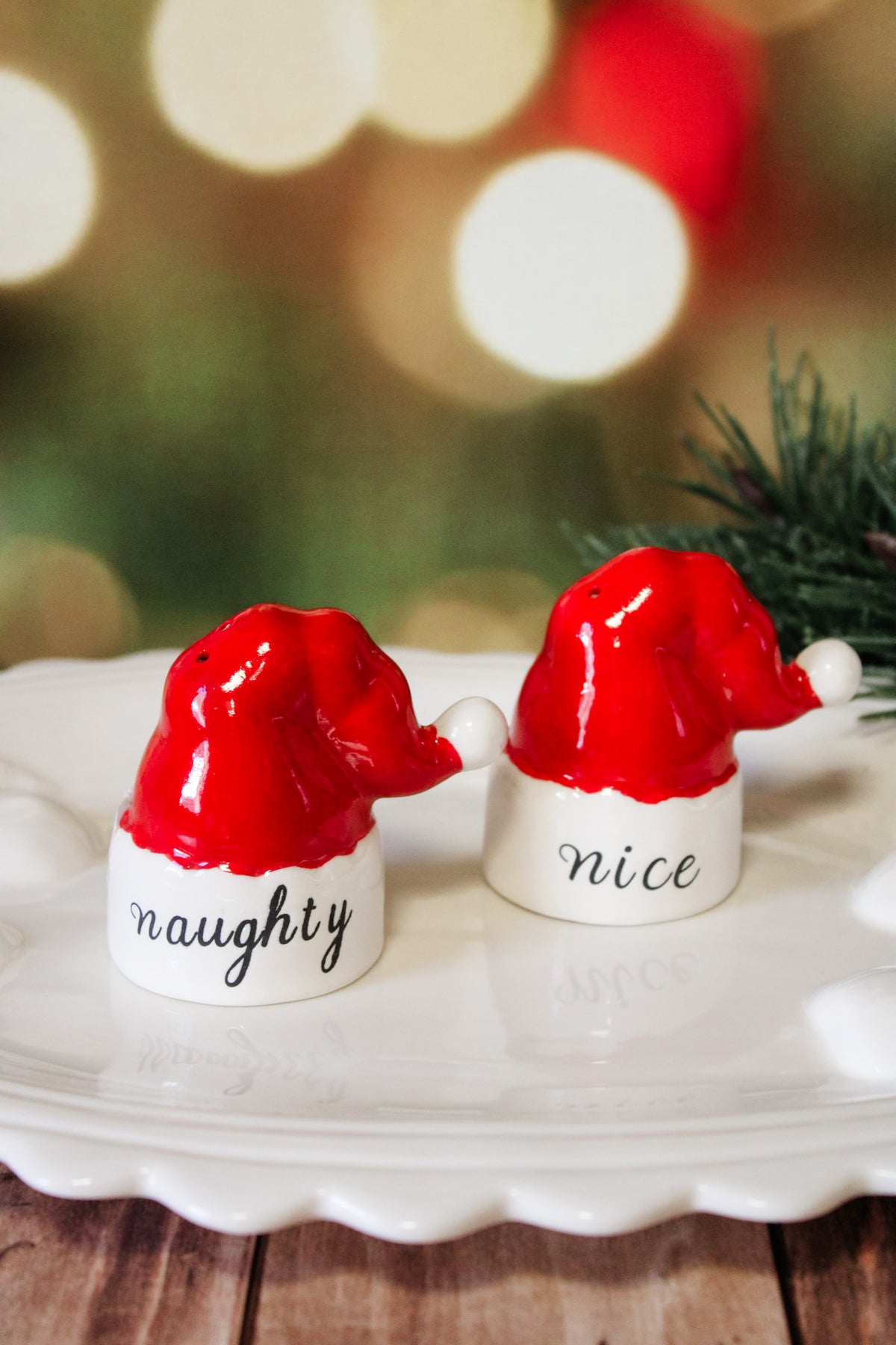 Naughty and Nice red and white Santa hat ceramic salt and pepper shakers for sale at the rustic barn in killingworth, CT