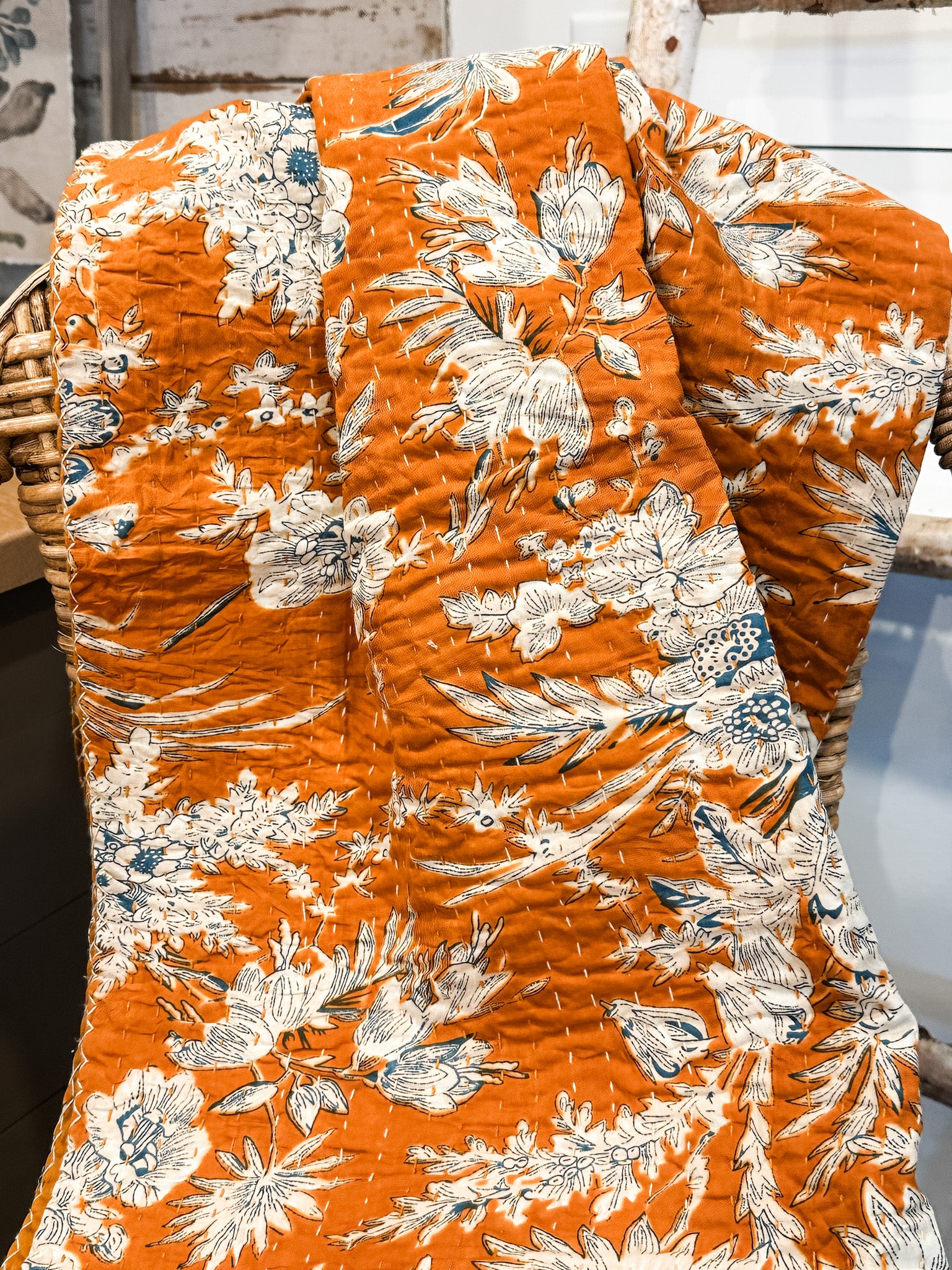 orange and blue cotton stitch quilt throw at the rustic barn in killingworth ct