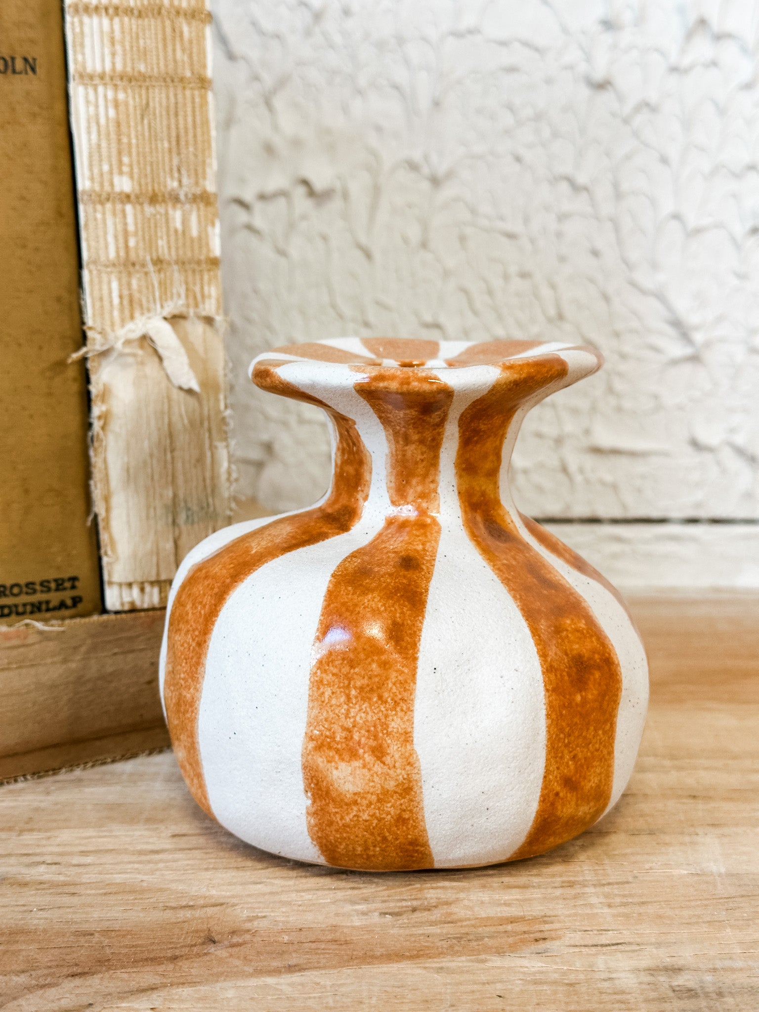 orange striped ceramic taper holder at the rustic barn in killingworth ct