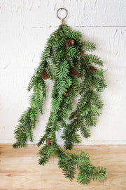 Oversized door swag with greenery and pinecones for Christmas and holiday decorating for sale at the rustic barn in Killingworth, CT