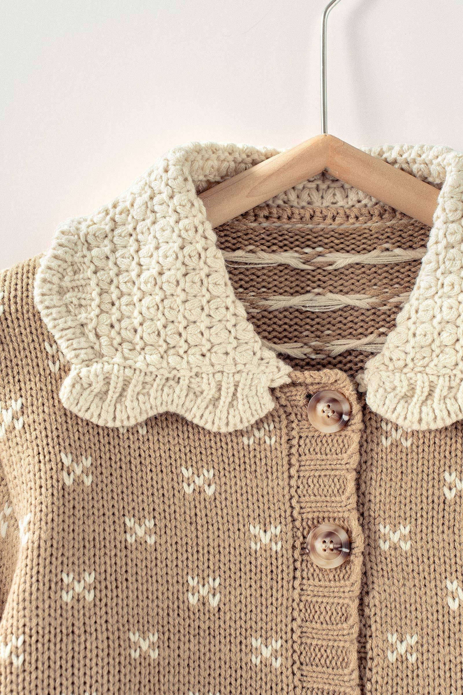 Brown knitted sweater with white pattern and ruffles on collar and sleeve at the rustic barn in Killingworth ct