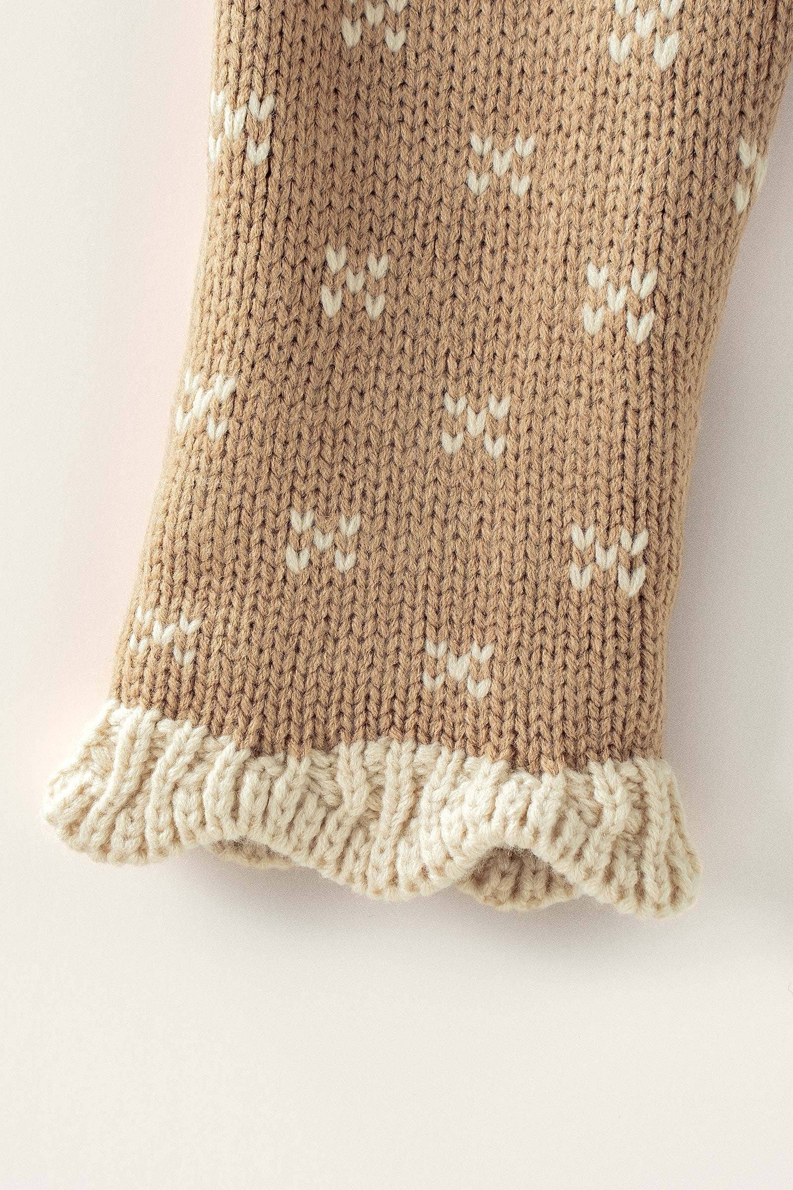 Brown knitted sweater with white pattern and ruffles on collar and sleeve at the rustic barn in Killingworth ct