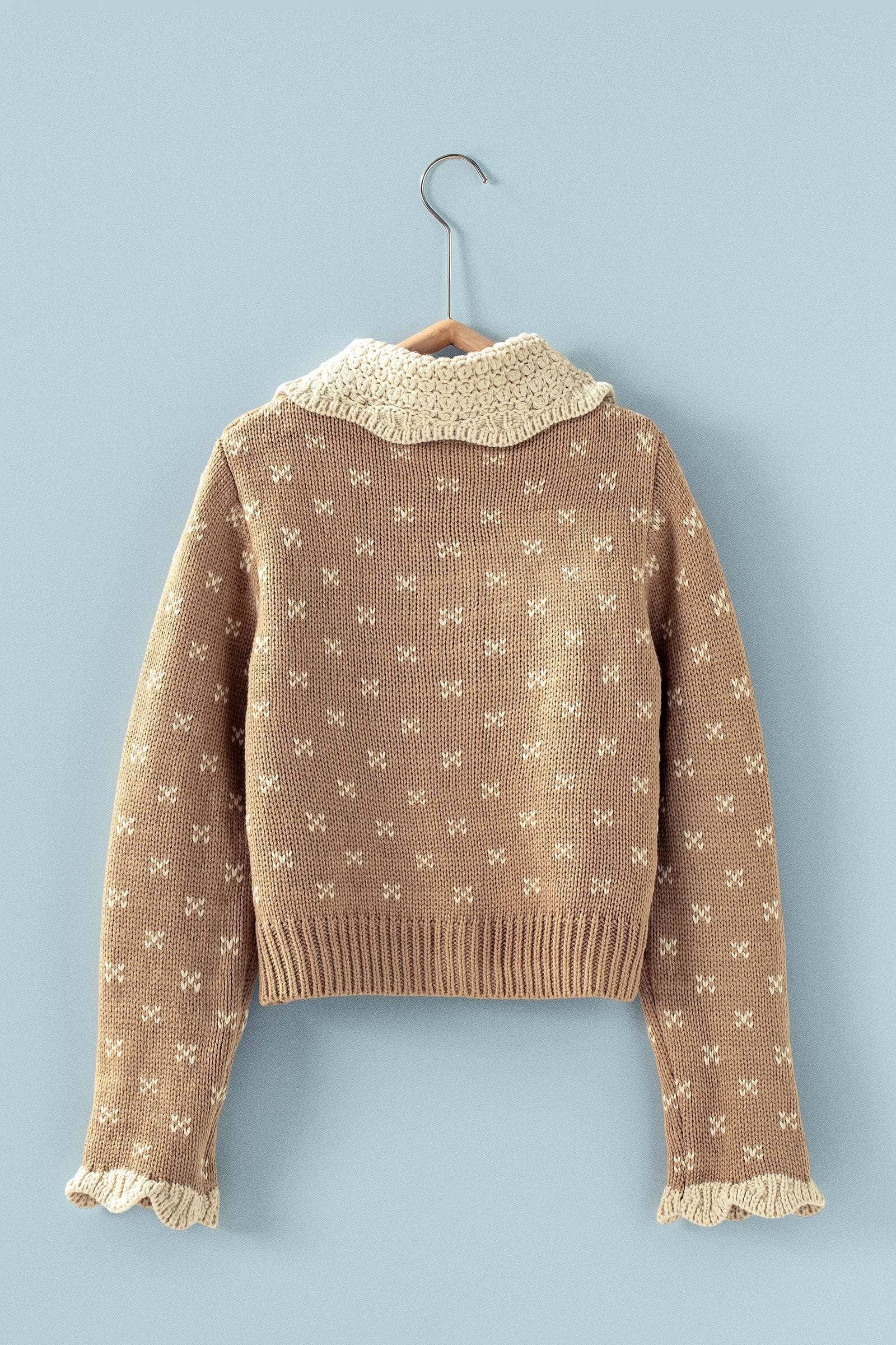 Brown knitted sweater with white pattern and ruffles on collar and sleeve at the rustic barn in Killingworth ct