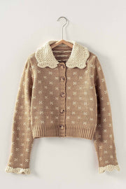 knit cardigan with ruffles on the collar and sleeve at the rustic barn in Killingworth ct