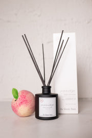 peach nectar hand poured reed diffuser at the rustic barn in Killingworth ct