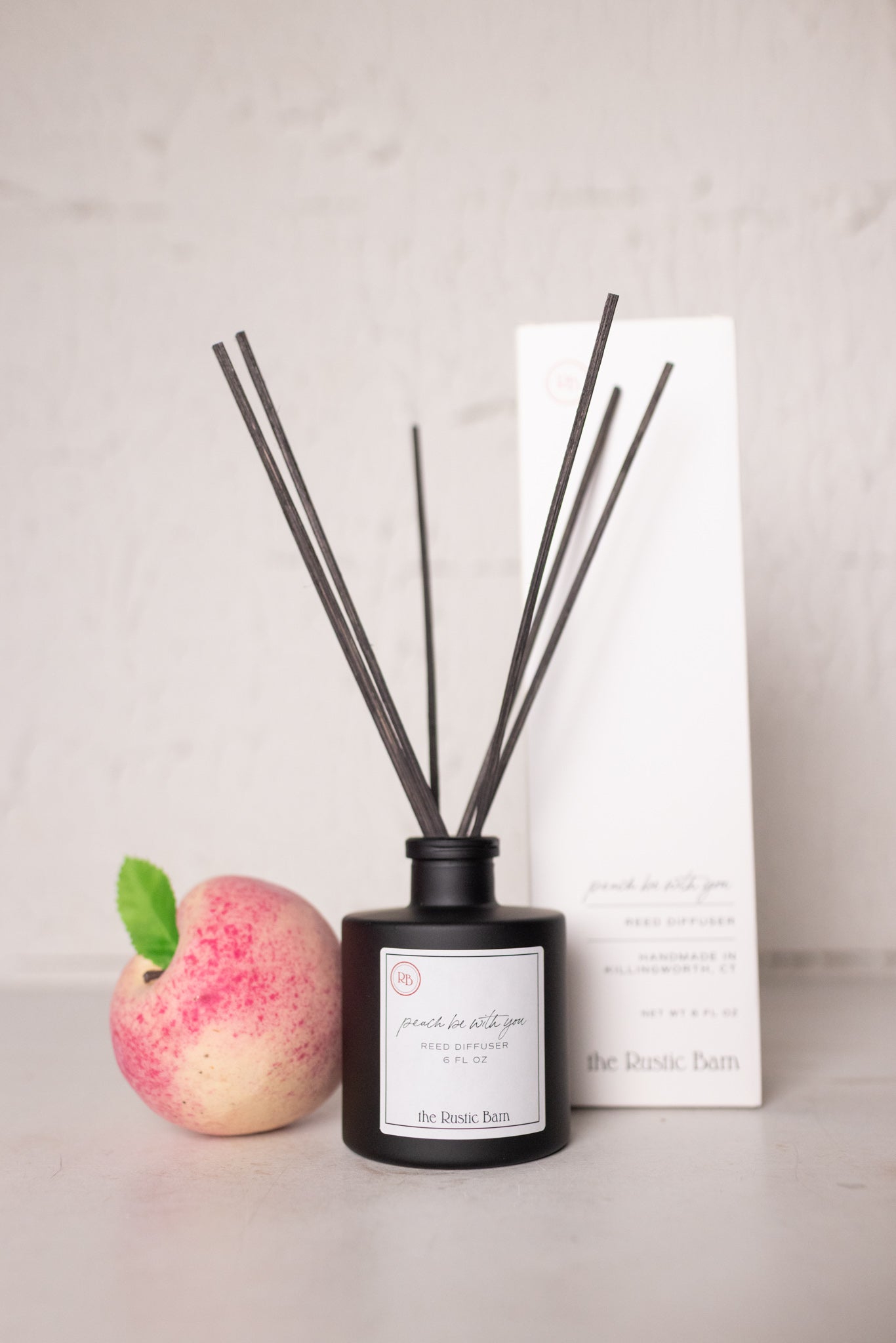 peach nectar hand poured reed diffuser at the rustic barn in Killingworth ct