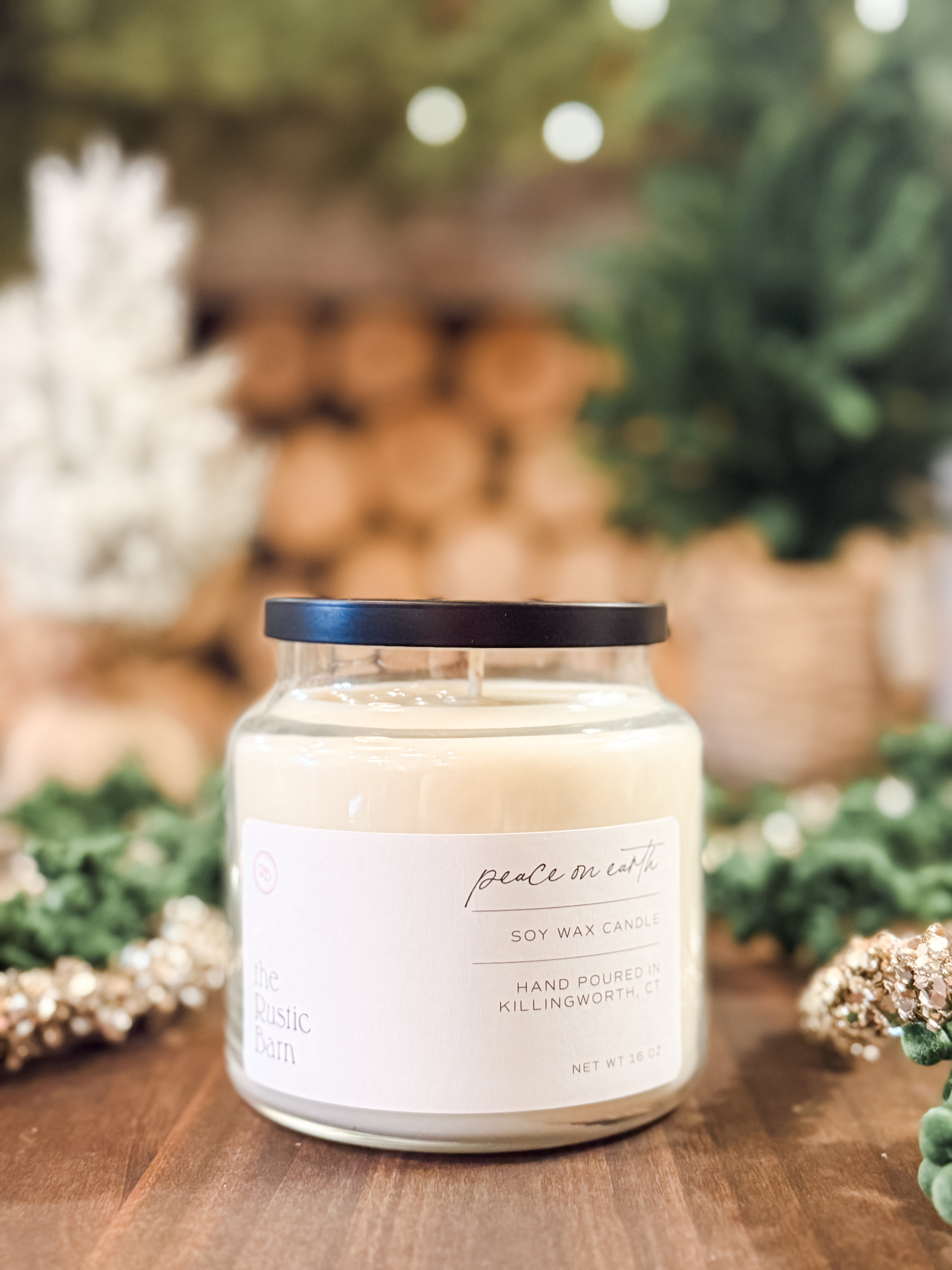 pine, eucalyptus, citrus and wood hand-poured soy 16 ounce candle at The Rustic Barn in Killingworth CT