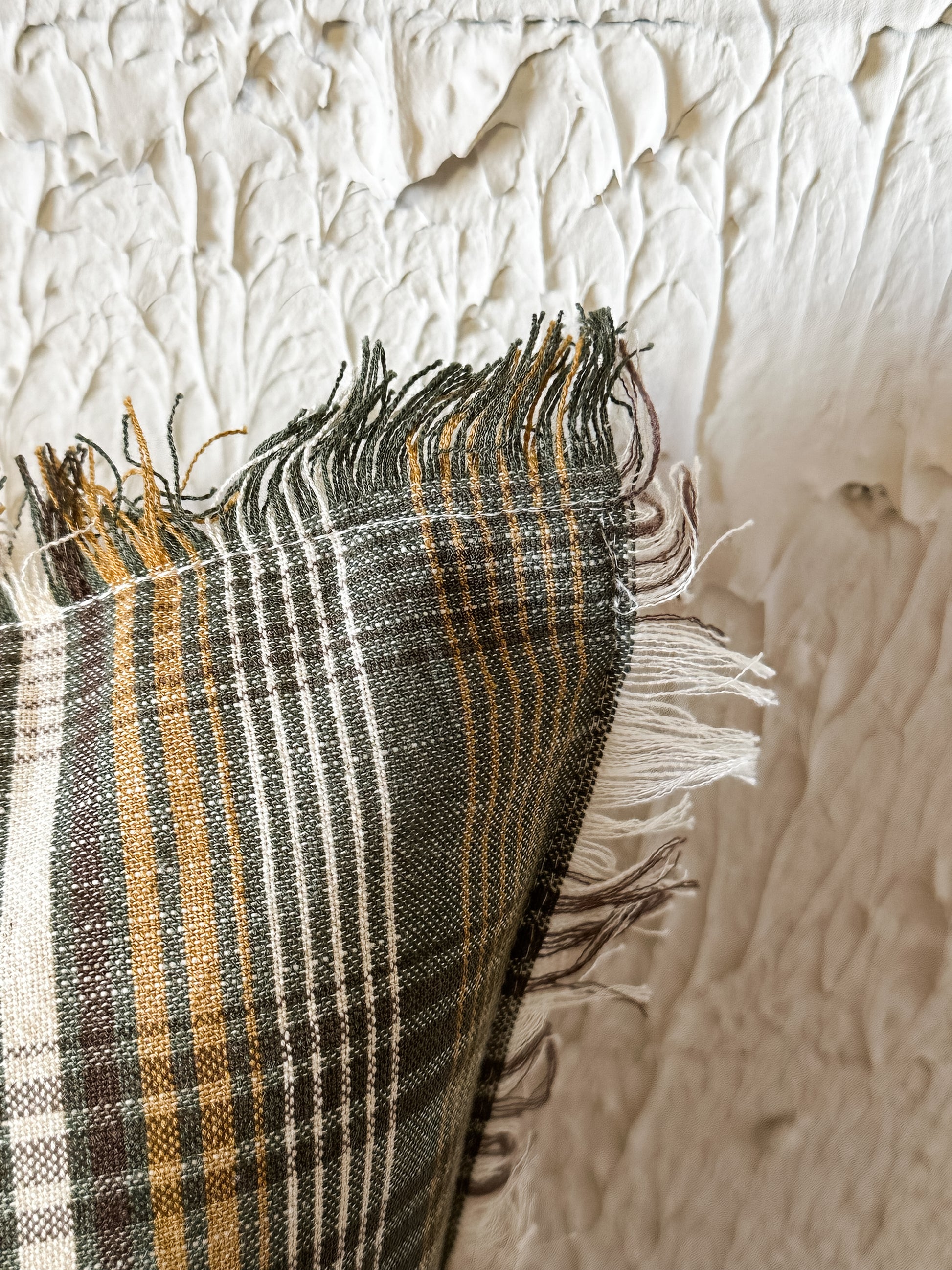 plaid linen and cotton pillow with eyelash fringe at the Rustic Barn in Killingworth, CT