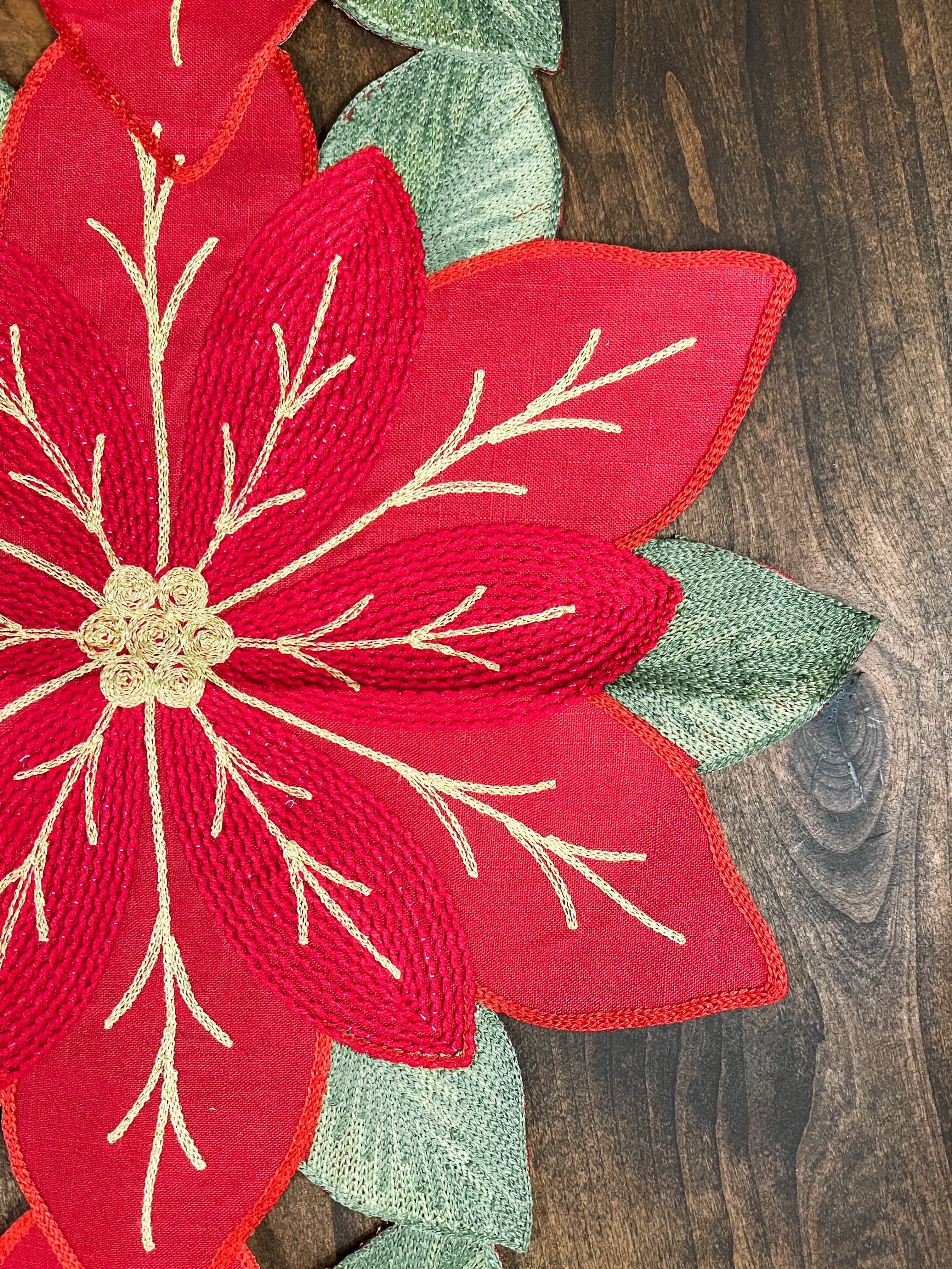red and green poinsettia table runner at the rustic barn in killingworth ct 