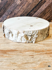 a round poplar wooden round birch riser at the rustic barn in killingworth ct