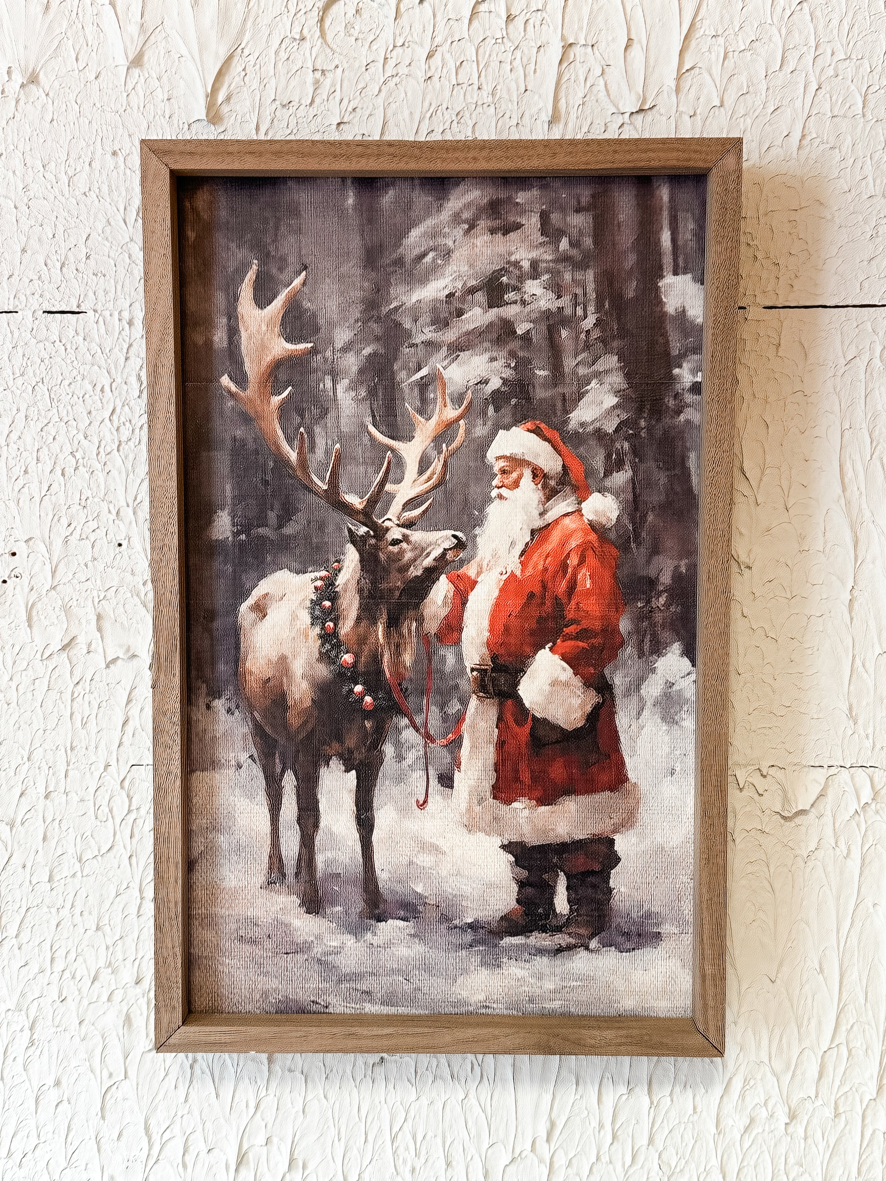 print in wooden frame of vintage Santa in the woods with reindeer at the rustic barn in killingworth ct