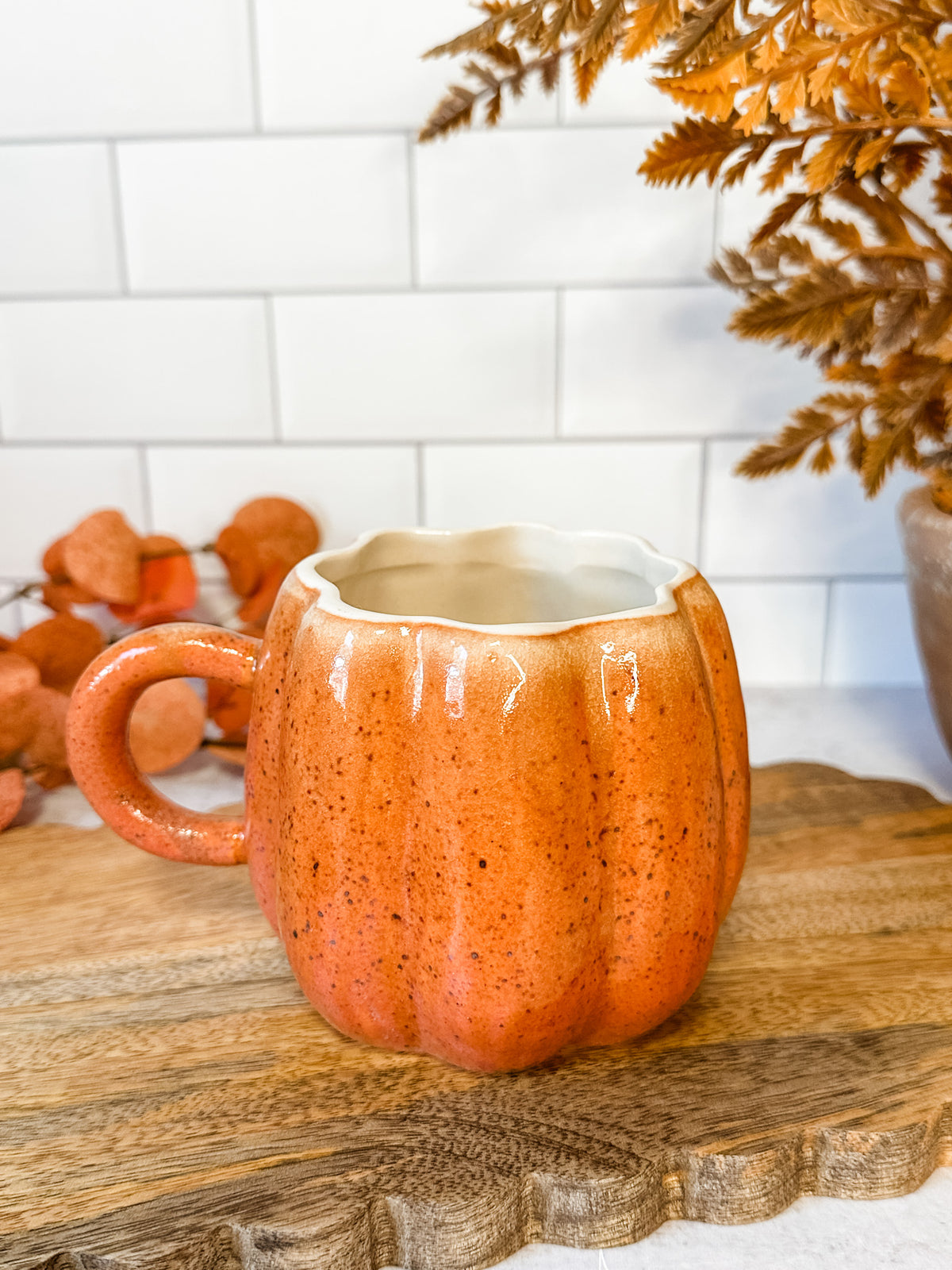 hand painted stoneware Pumpkin mug set featuring a teaspoon and leaf plate for fall at the rustic barn in killingworth, CT
