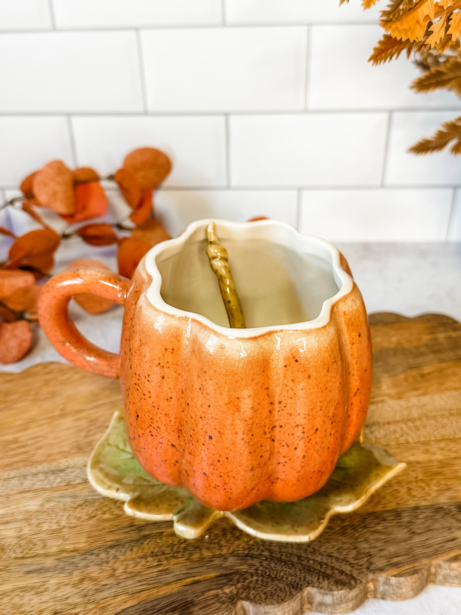 hand painted stoneware Pumpkin mug set featuring a teaspoon and leaf plate for fall at the rustic barn in killingworth, CT