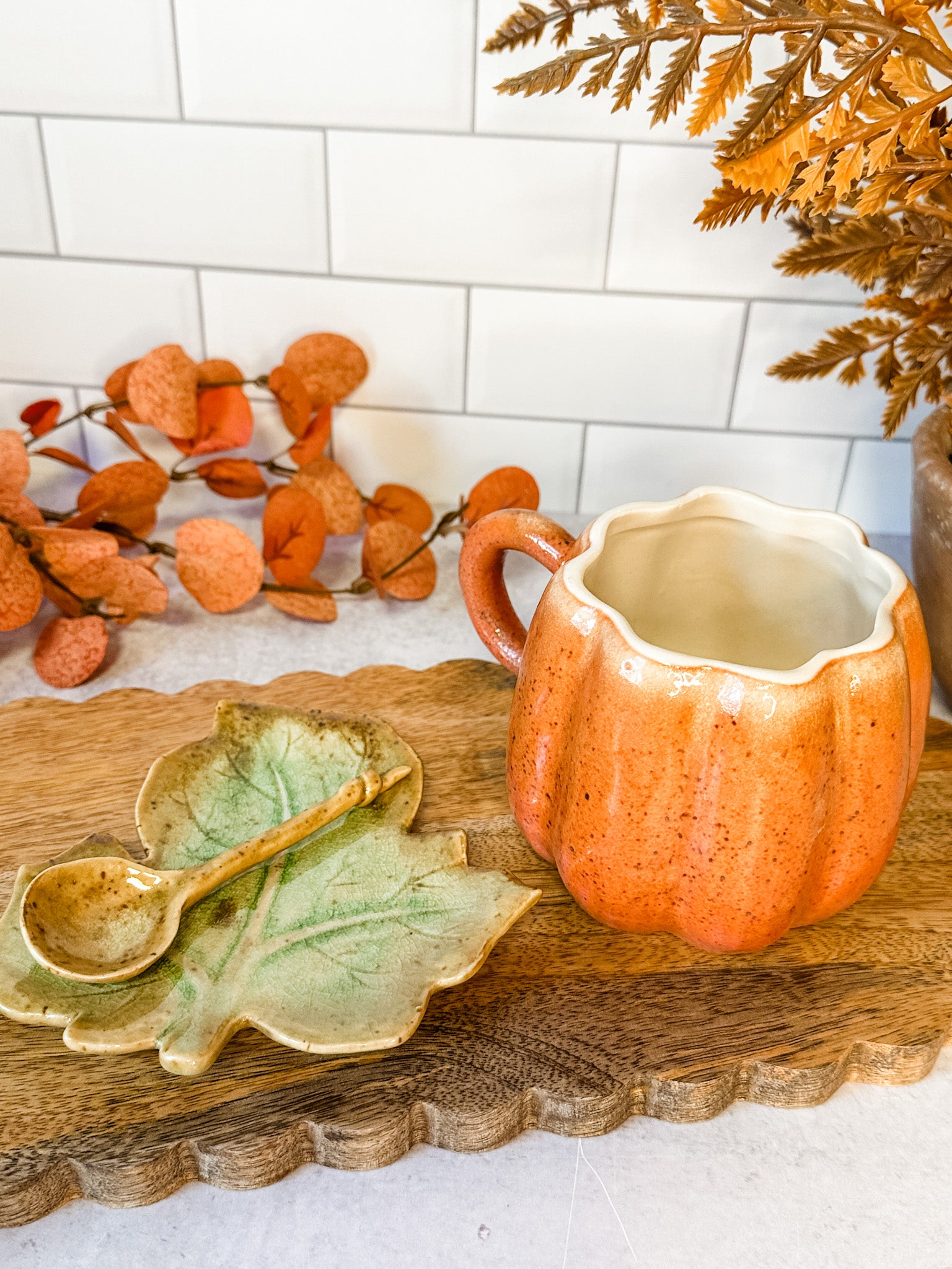 hand painted stoneware Pumpkin mug set featuring a teaspoon and leaf plate for fall at the rustic barn in killingworth, CT