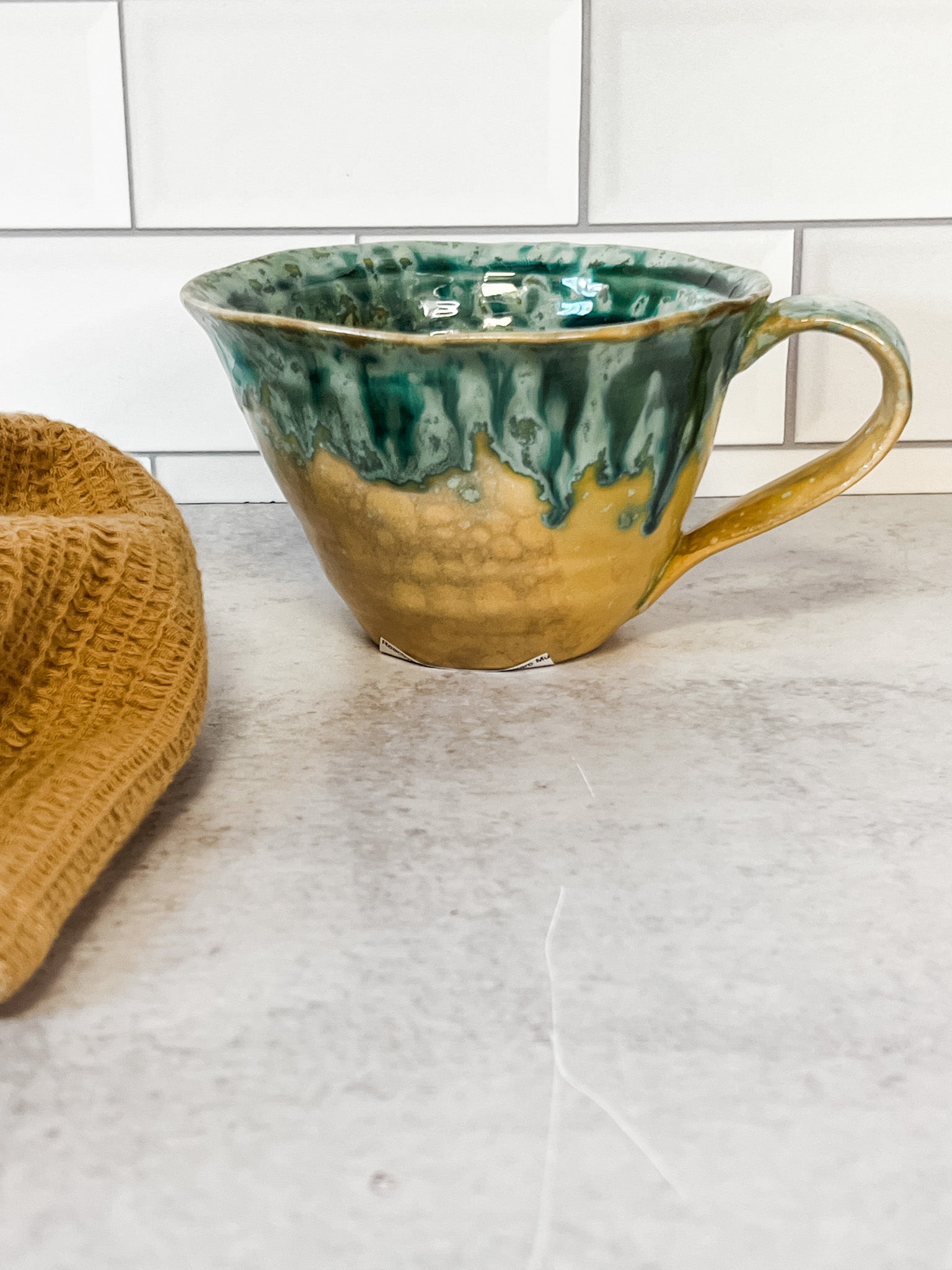 moss green stoneware mugs with reactive glaze at the rustic barn in killingworth ct