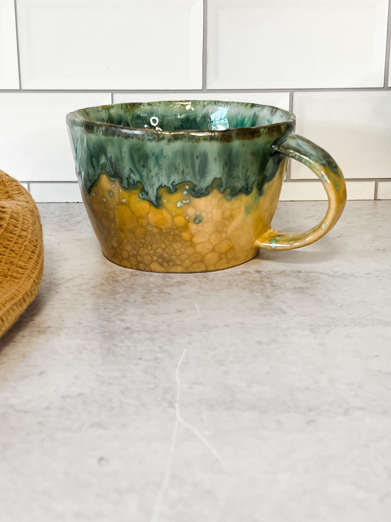moss green stoneware mugs with reactive glaze at the rustic barn in killingworth ct