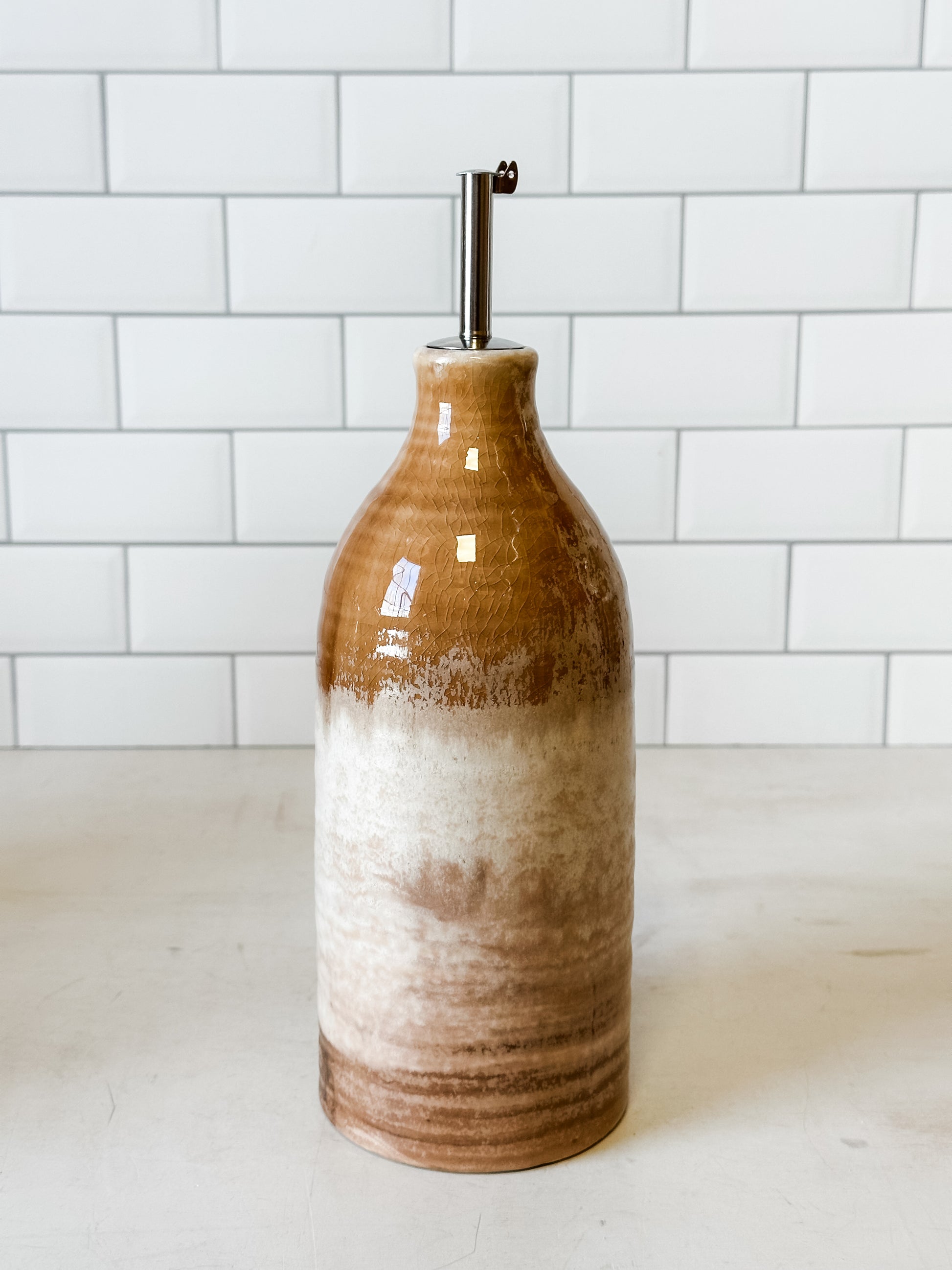 reactive glaze stoneware oil cruet with stainless steel spout at the Rustic Barn in Killingworth, CT