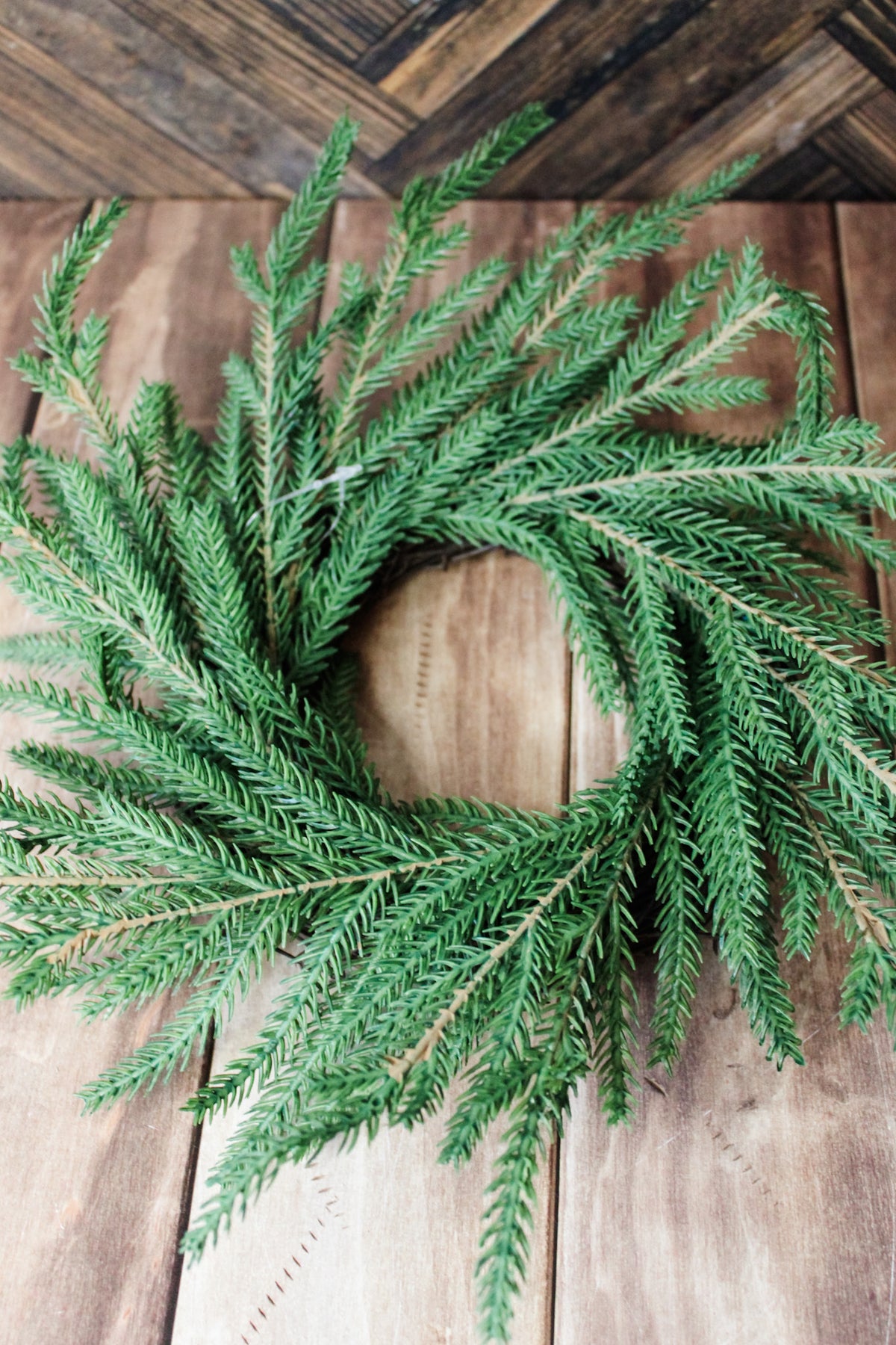 Realistic christmas candle taper ring for the holidays with pine details real touch for sale at the rustic barn in Killingworth, CT